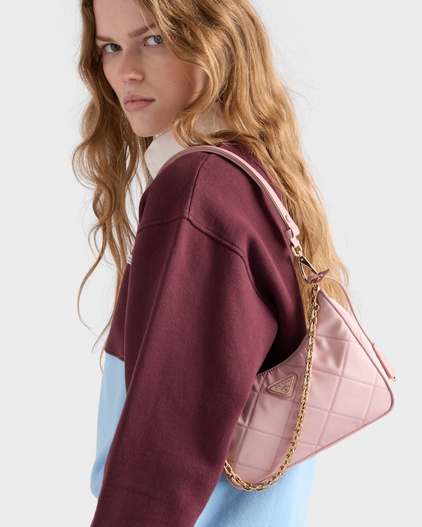 Prada Re-Edition quilted Re-Nylon mini-bag - Peach Prada Re-Edition quilted Re-Nylon mini-bag - Peach