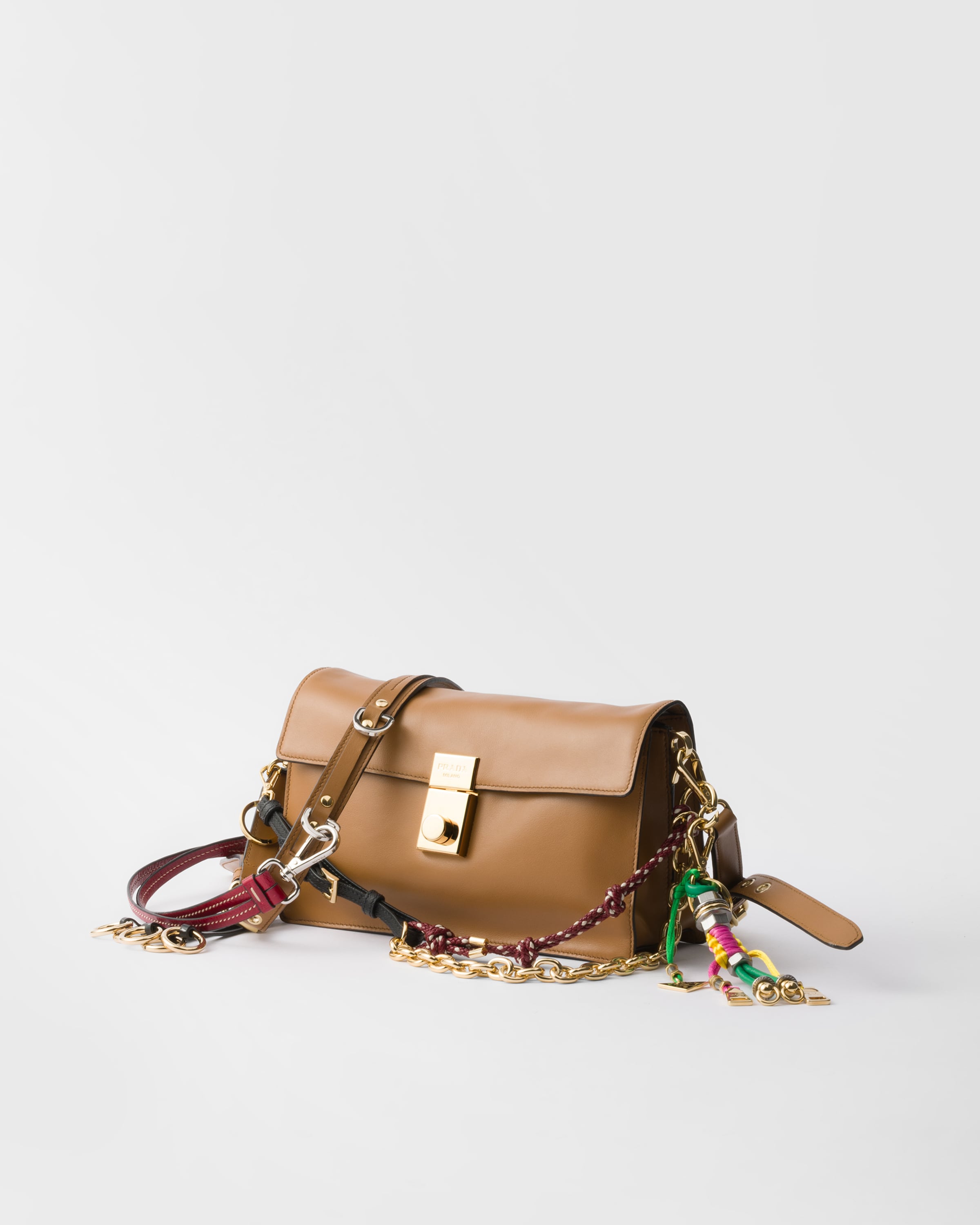 Prada Soft Sound Small Leather Shoulder Bag With Charms In Caramel