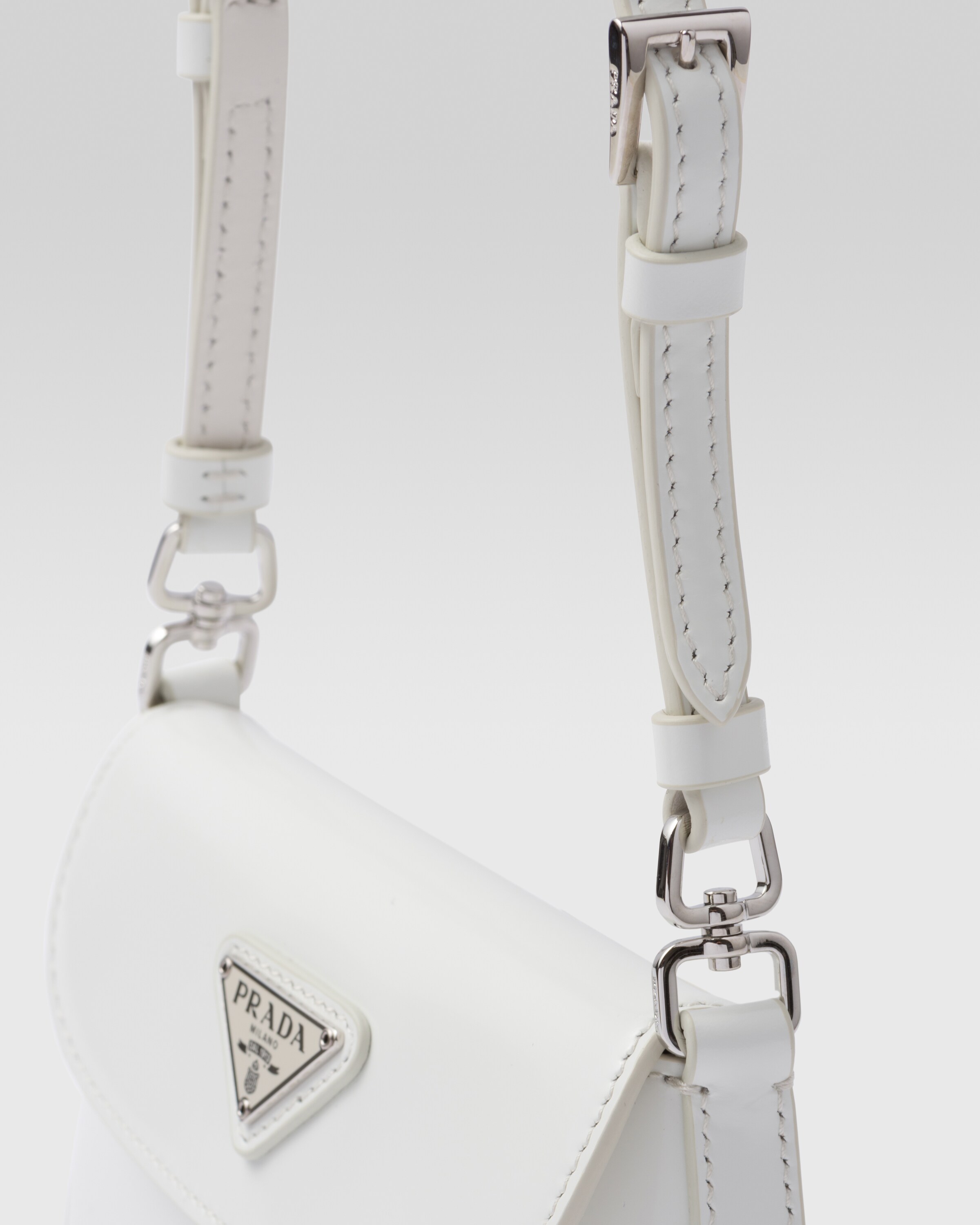 Cleo Small Leather Shoulder Bag in White - Prada