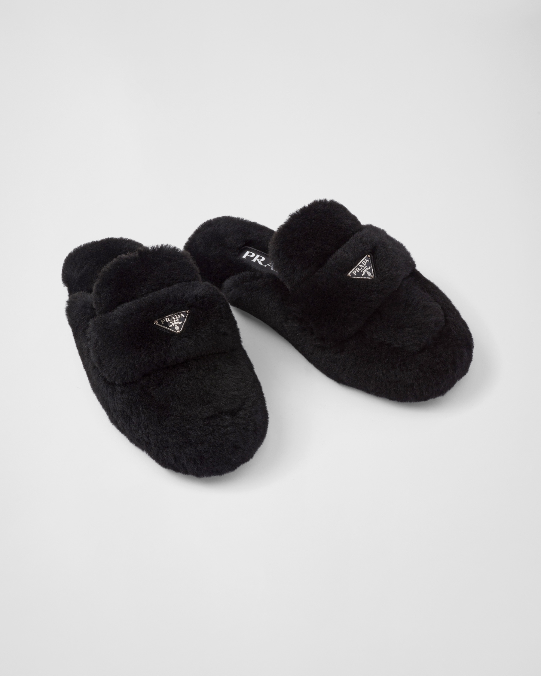 PRADA 25S FLAT MULES IN BLACK RABBIT FUR