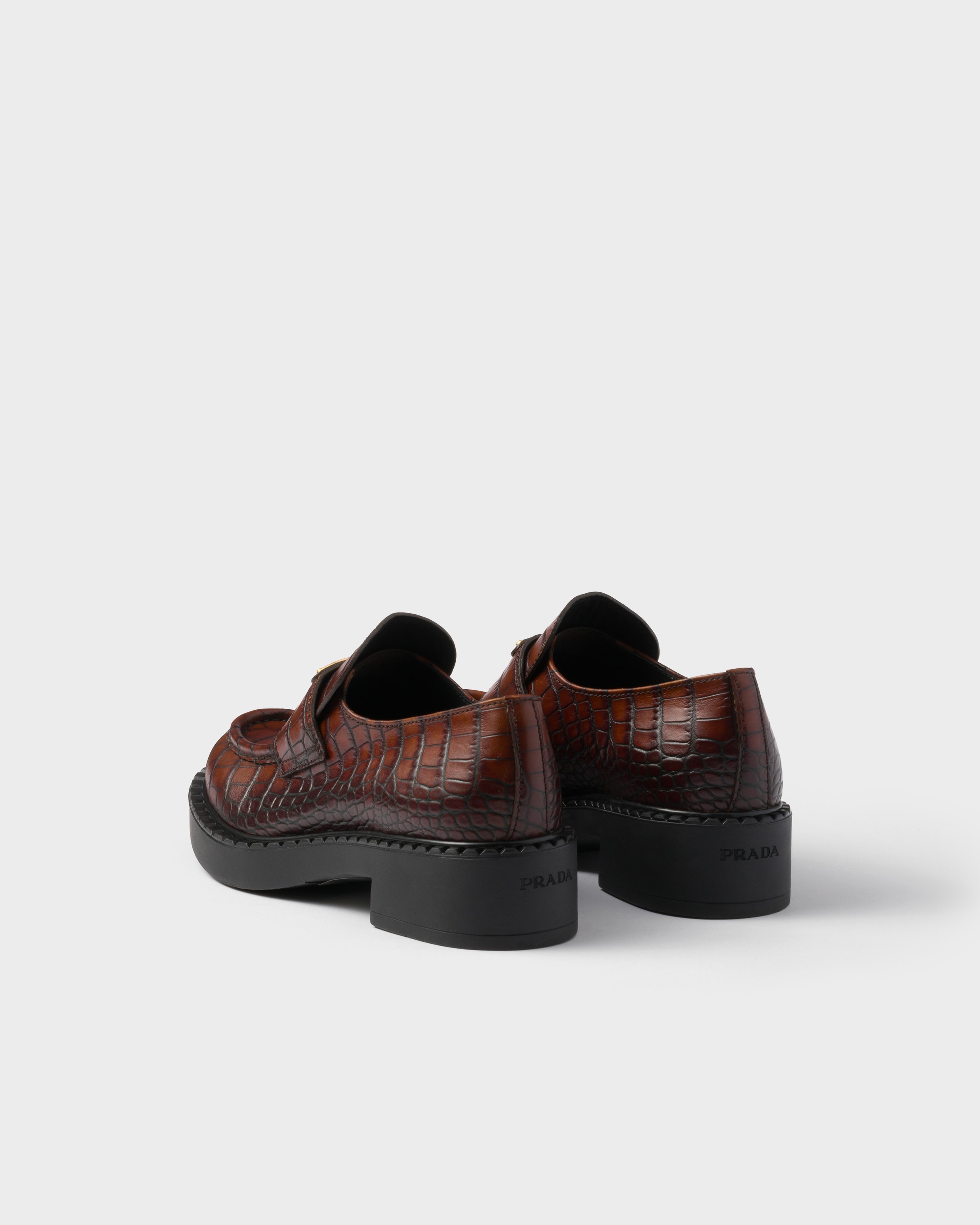 Chocolate crocodile-print leather loafers