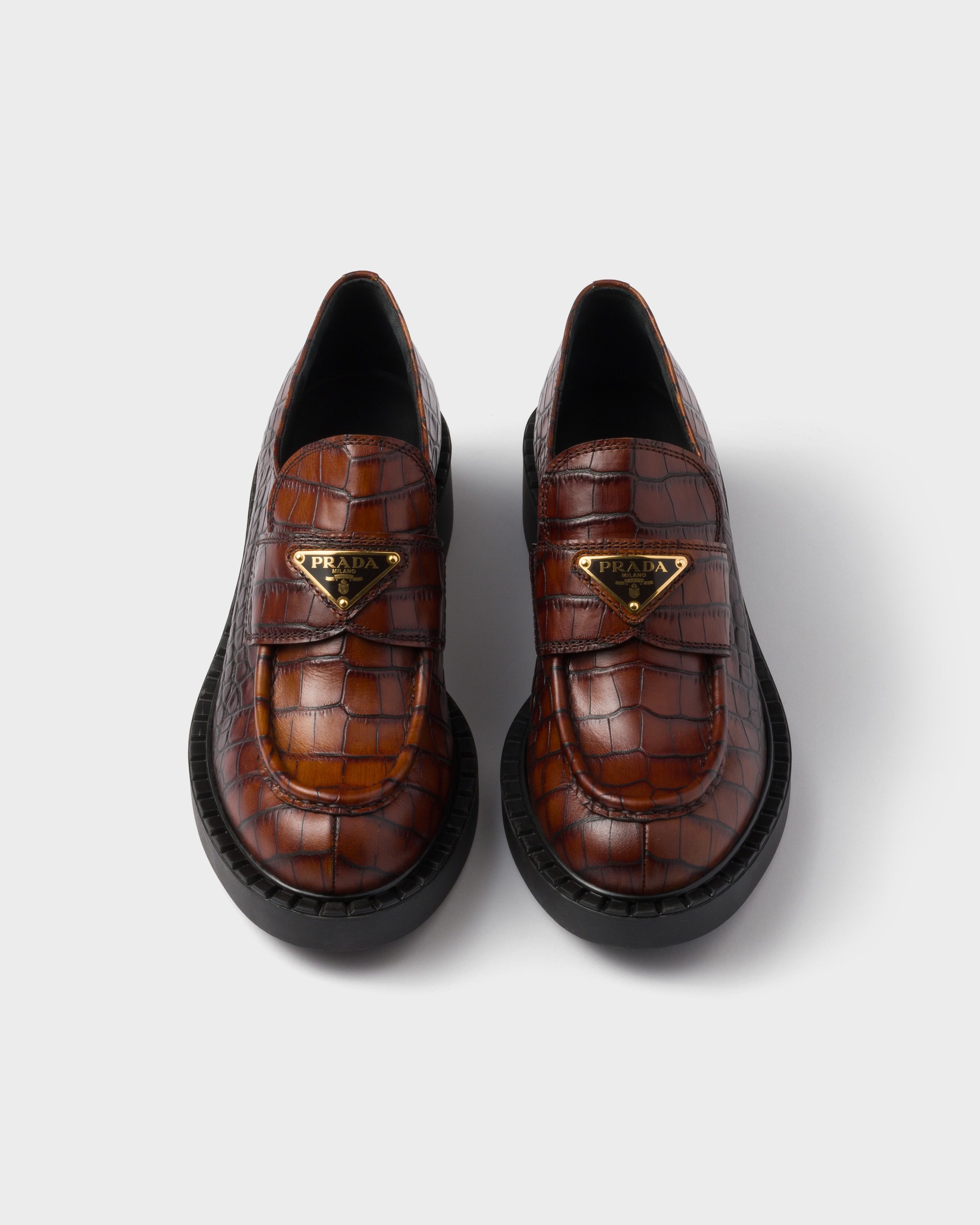 Chocolate crocodile-print leather loafers