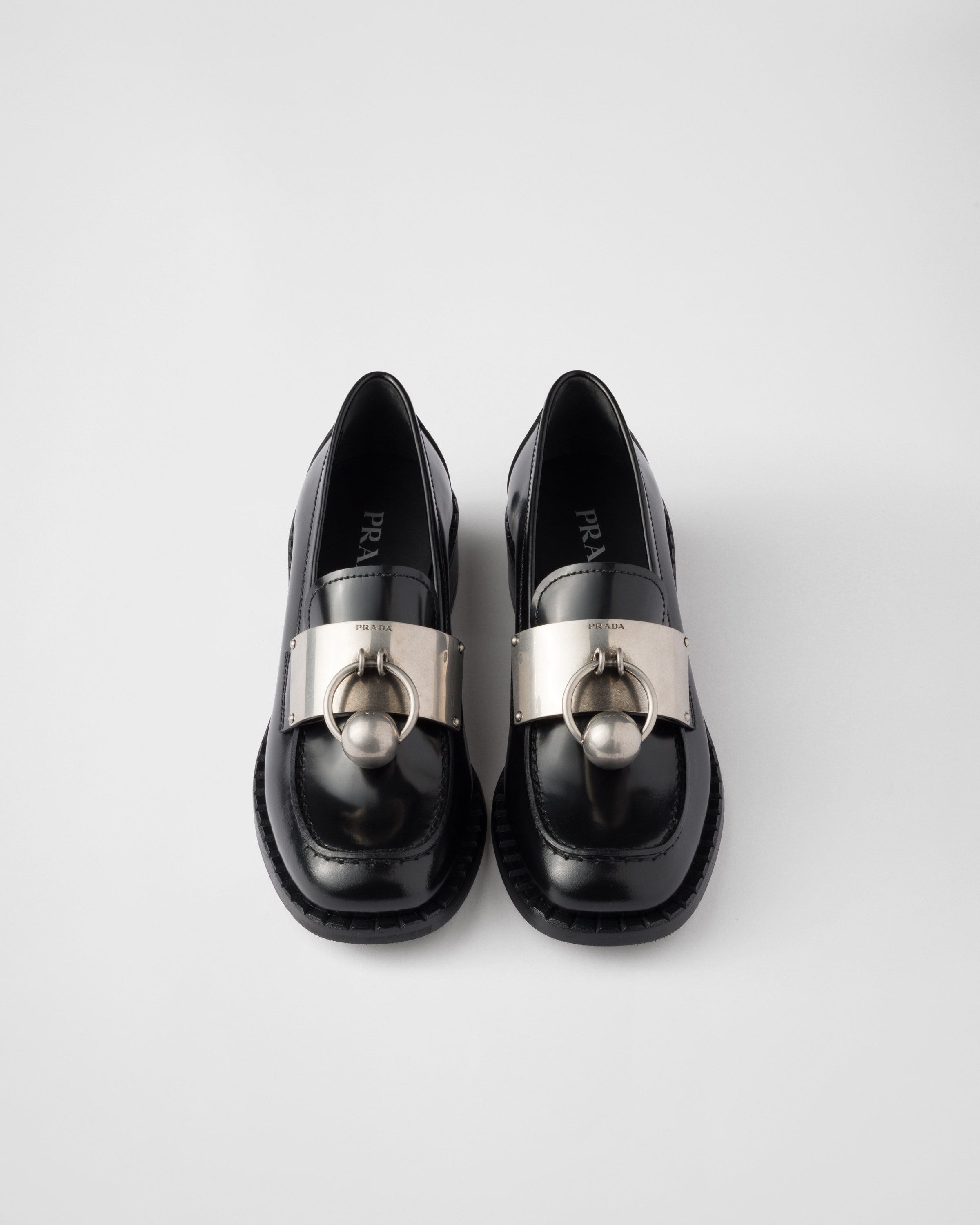 Shop Prada Brushed Leather Loafers With Metal Details In Black