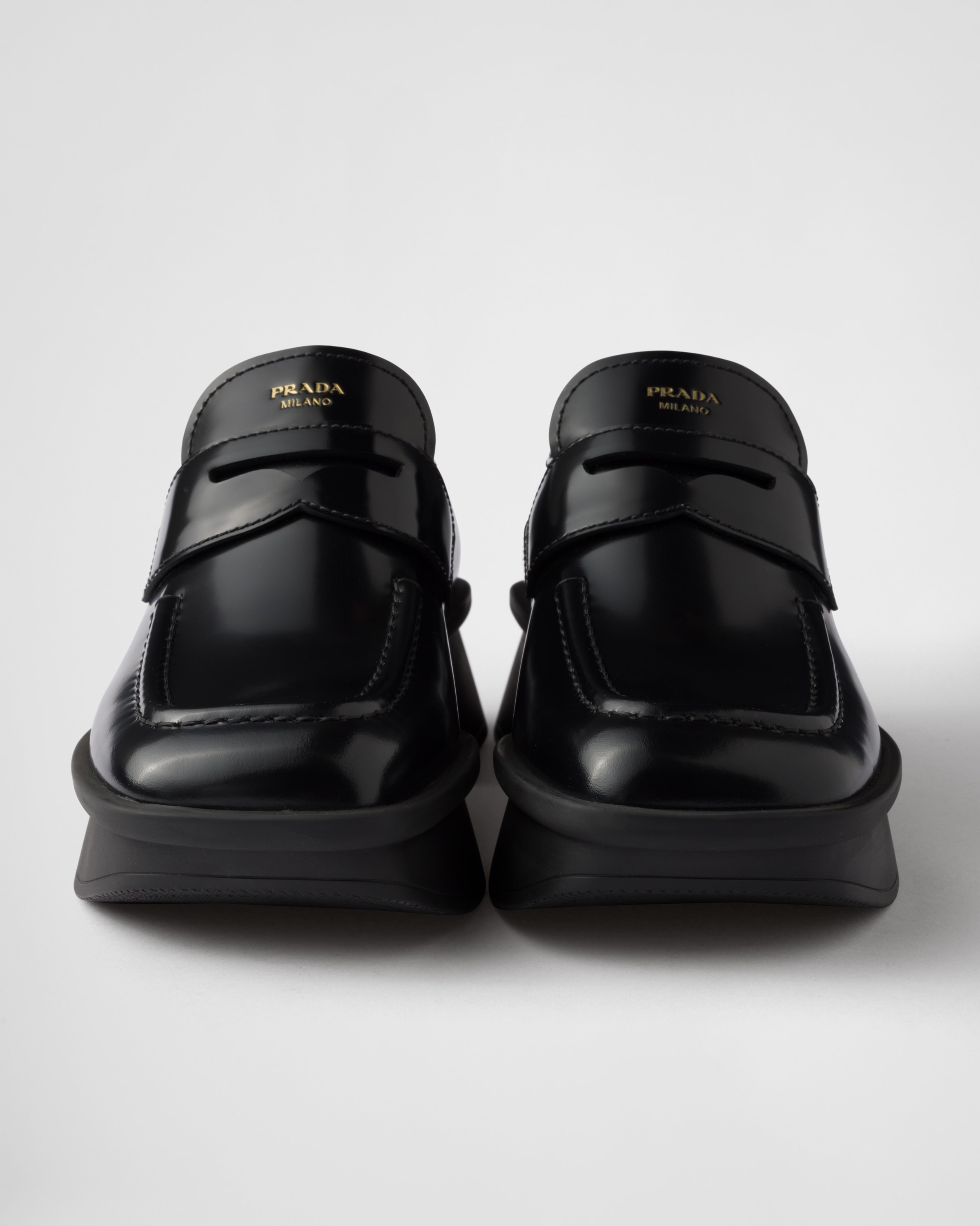 Black Equal brushed leather loafers | PRADA