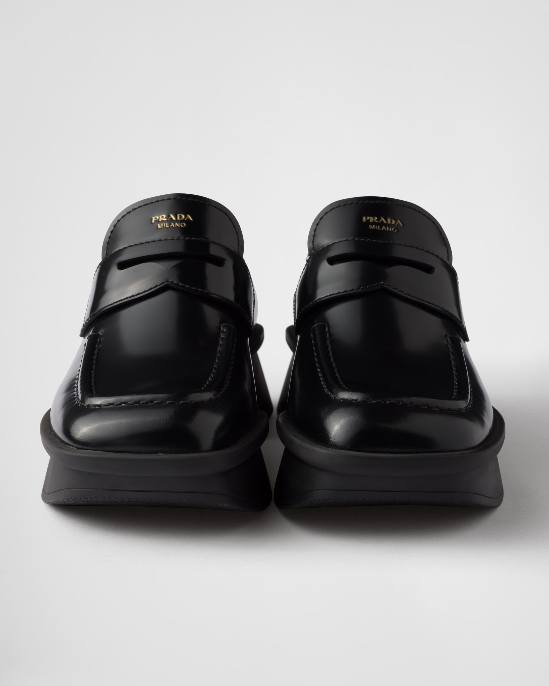 PRADA 26S LOAFERS IN BLACK CALFSKIN WITH LOGO SILVER HARDWARE