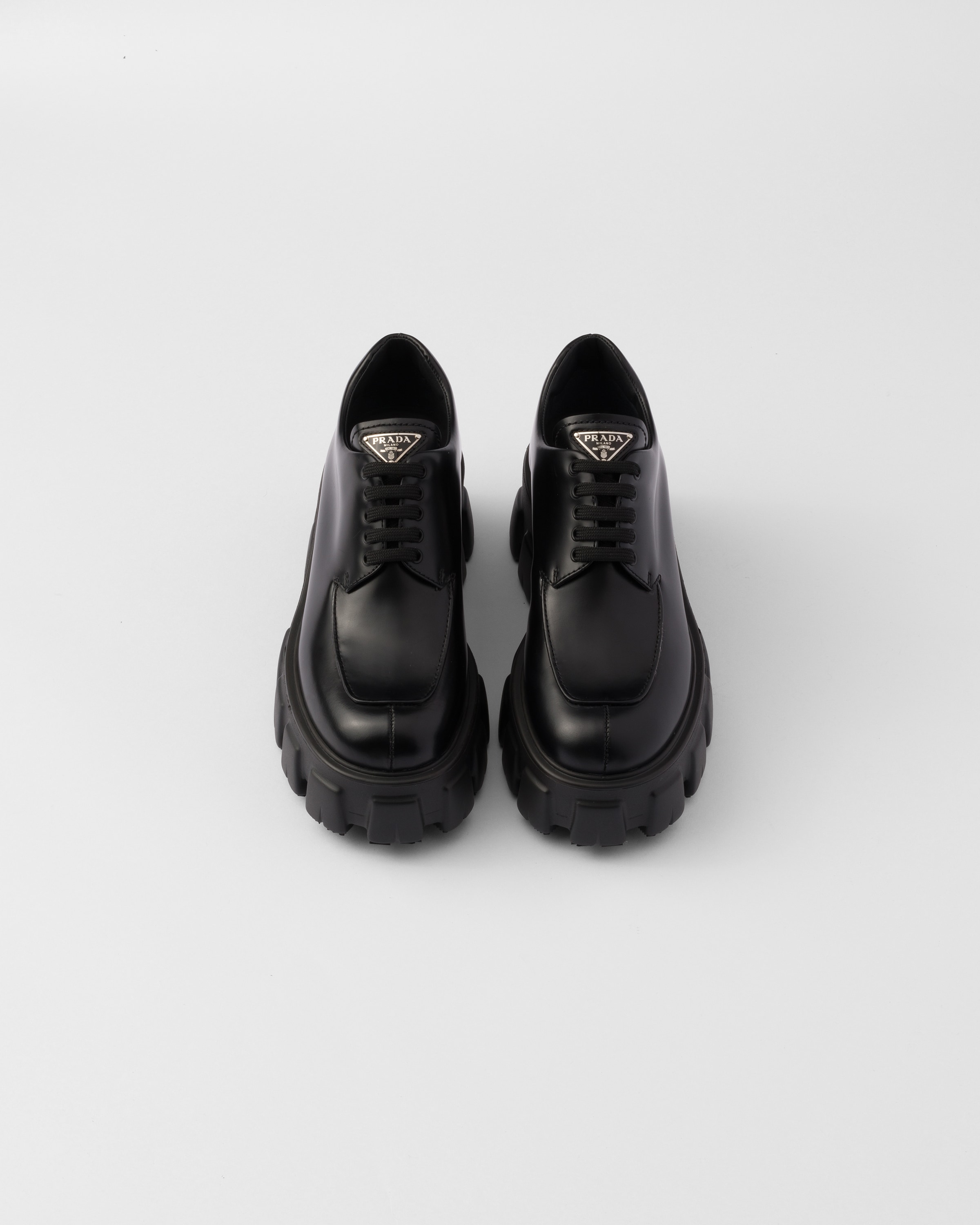 Prada lace shop up sneakers