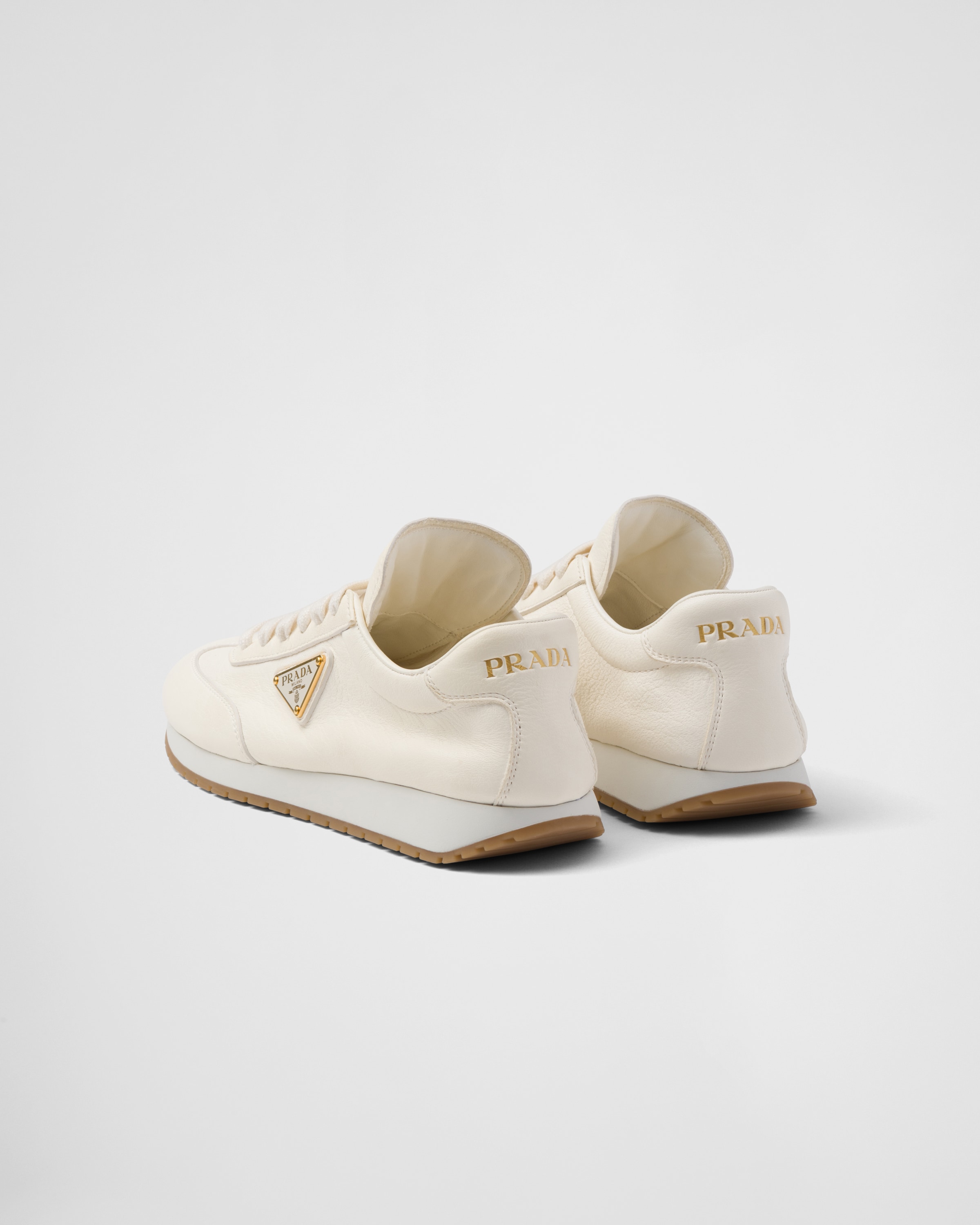 Shop Prada Leather Sneakers In Ivory