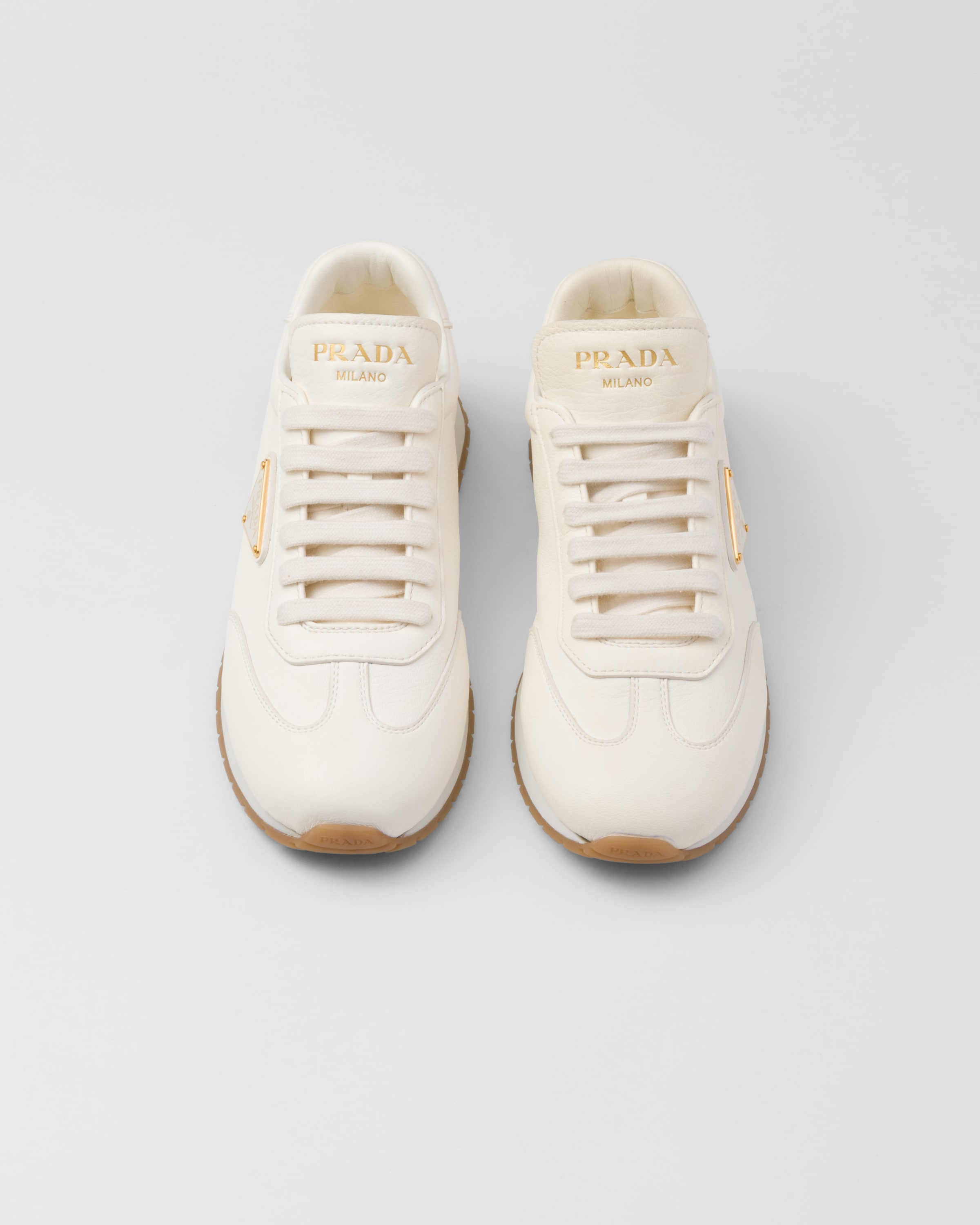 Shop Prada Leather Sneakers In Ivory