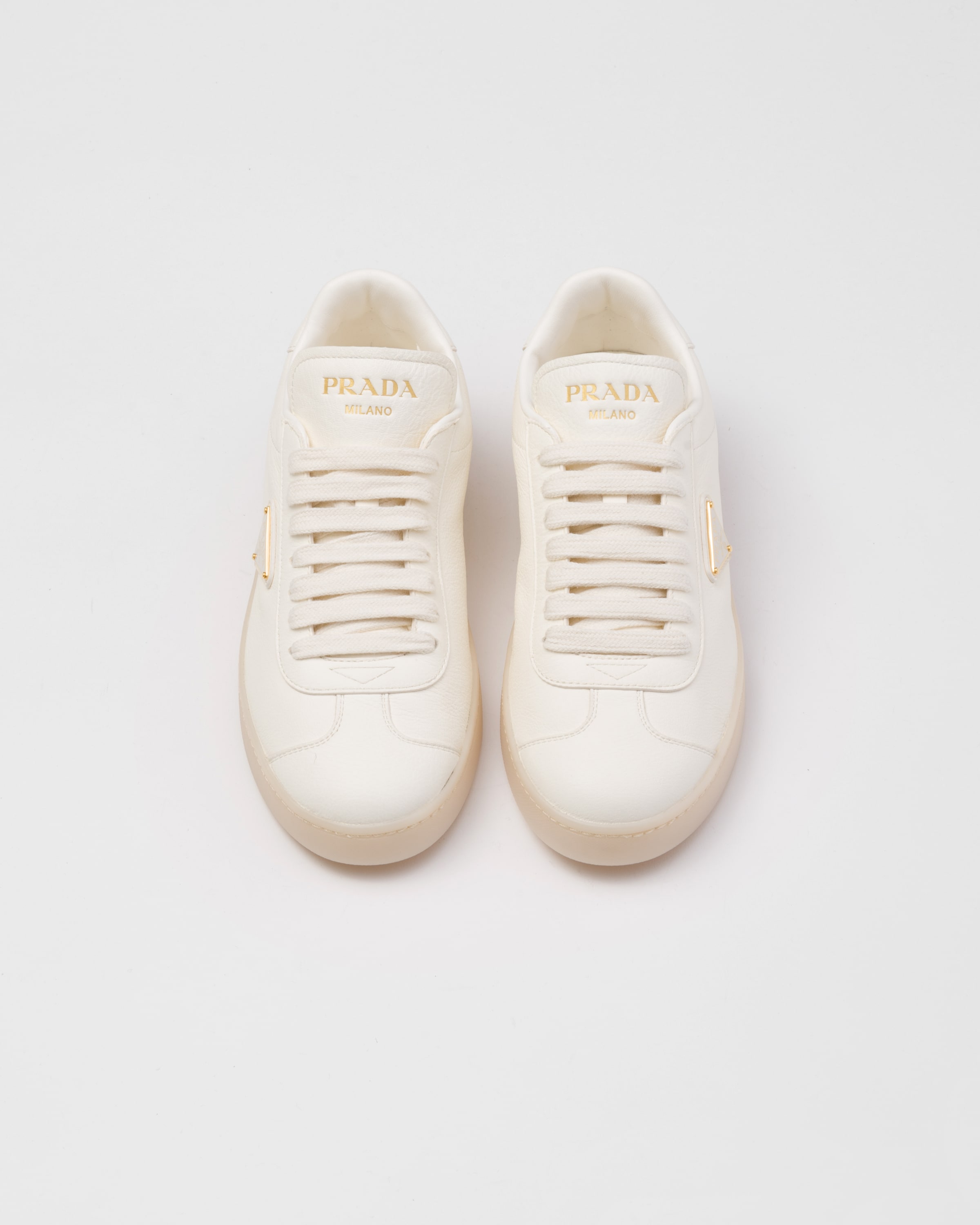 Shop Prada Leather Sneakers In Ivory