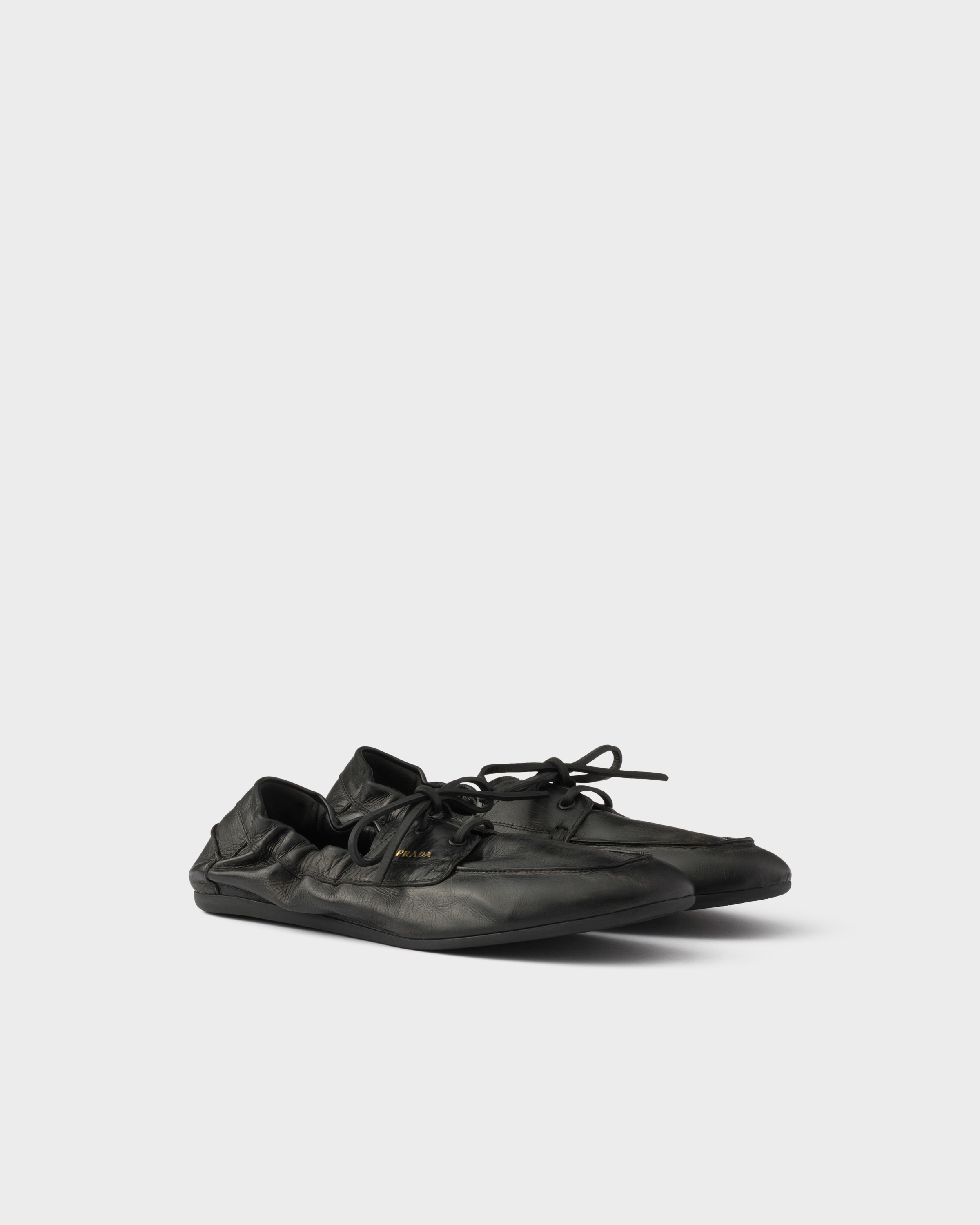 Black Shuffle antiqued leather boat shoes | PRADA - United States