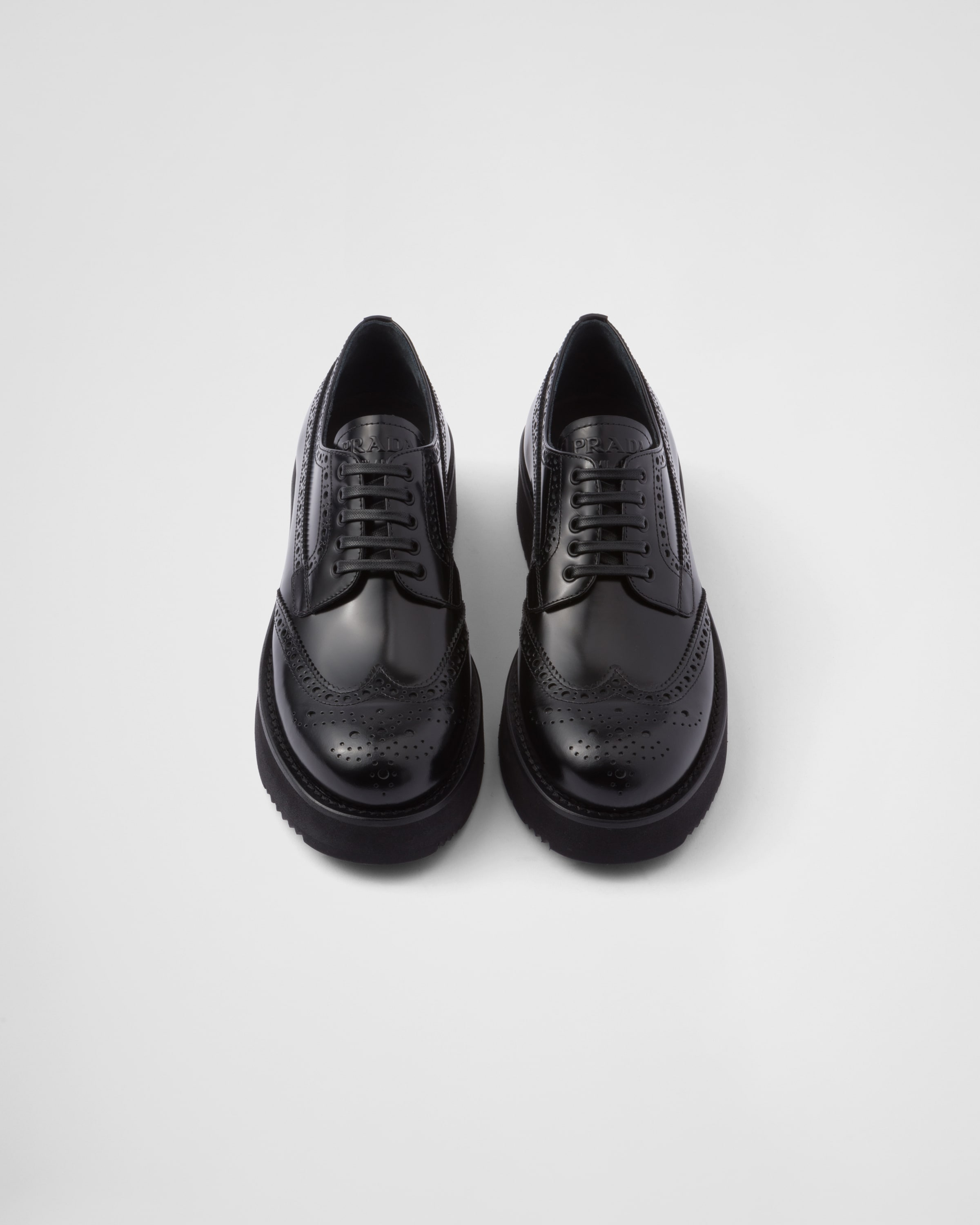 Shop Prada Brushed Leather Derby Shoes In Black