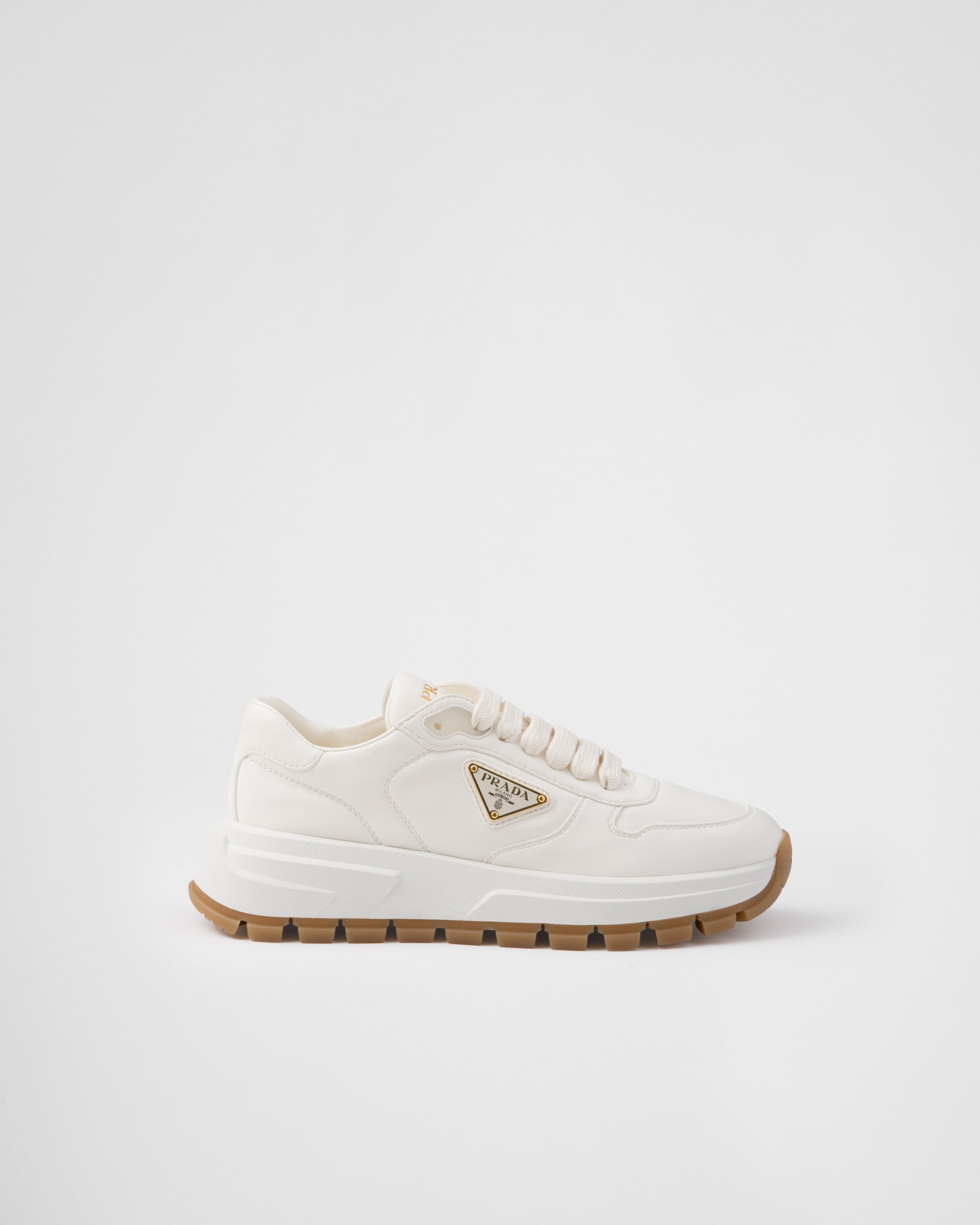 Shop Prada Leather Sneakers In Elfenbein