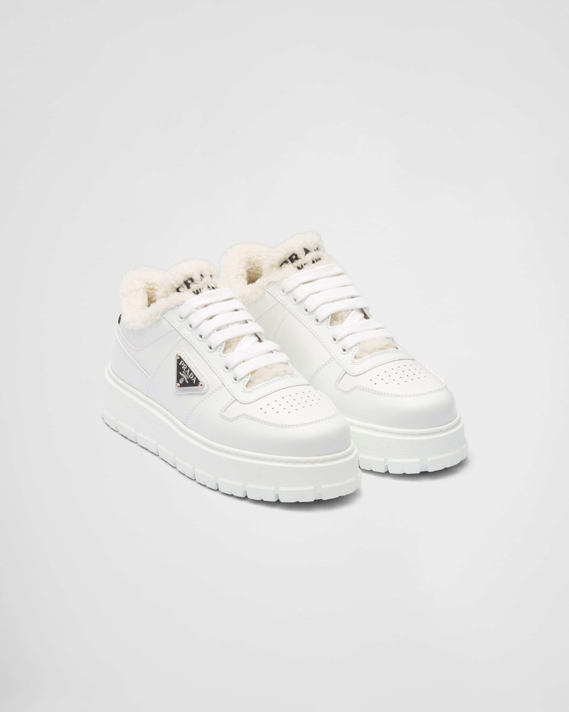 White Leather and shearling sneakers | Prada