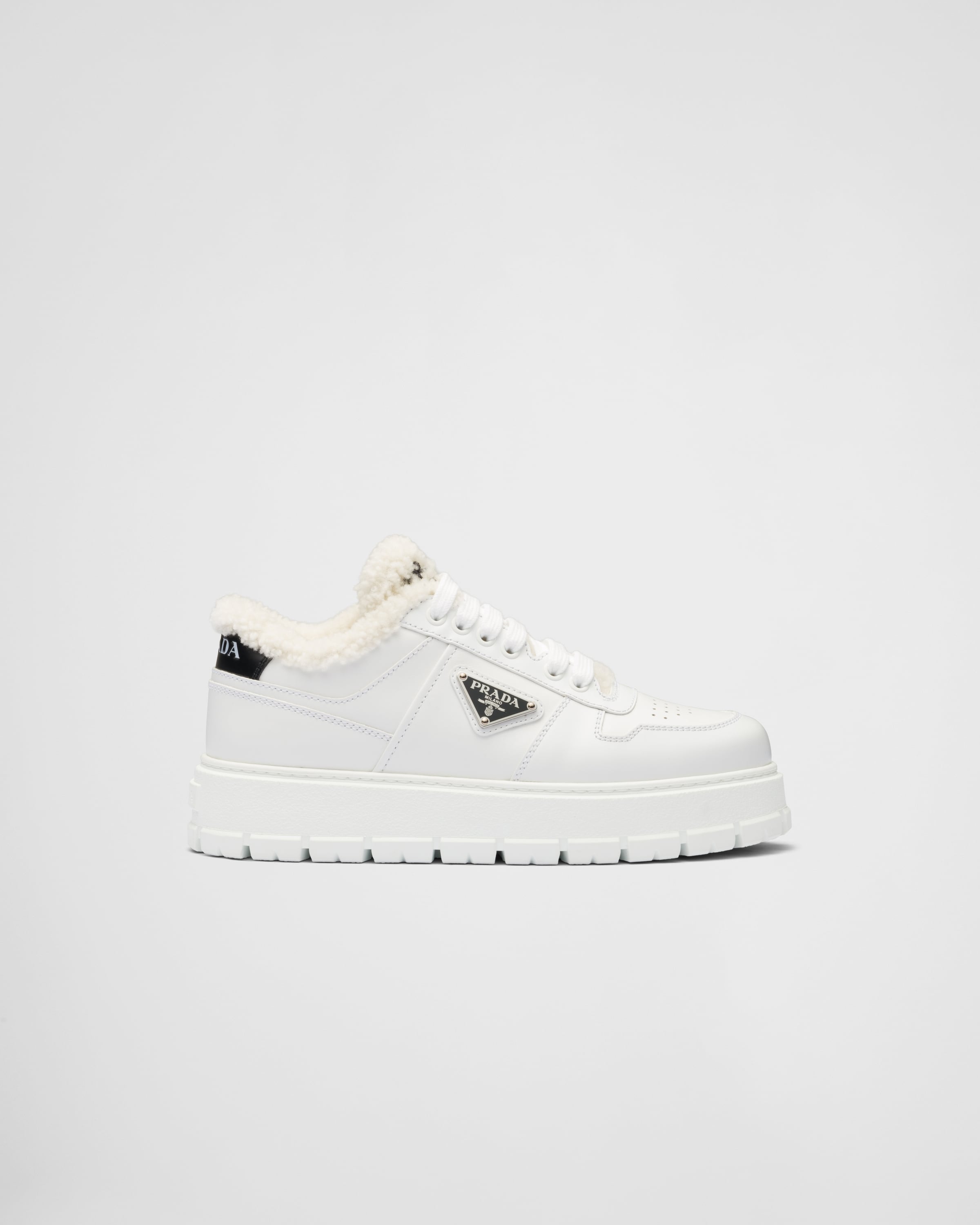 White Leather and shearling sneakers | Prada