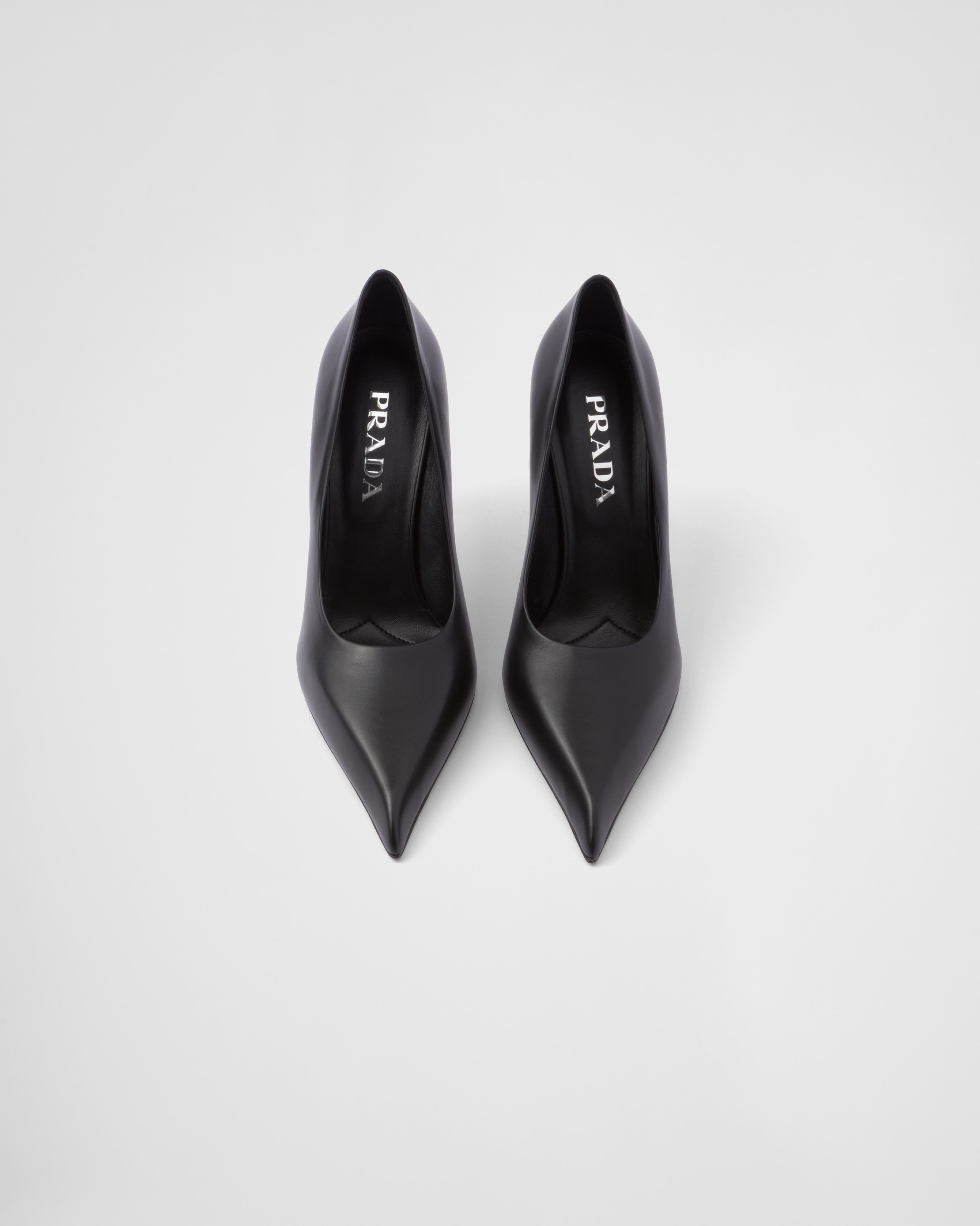 Shop Prada Leather Pumps In Black