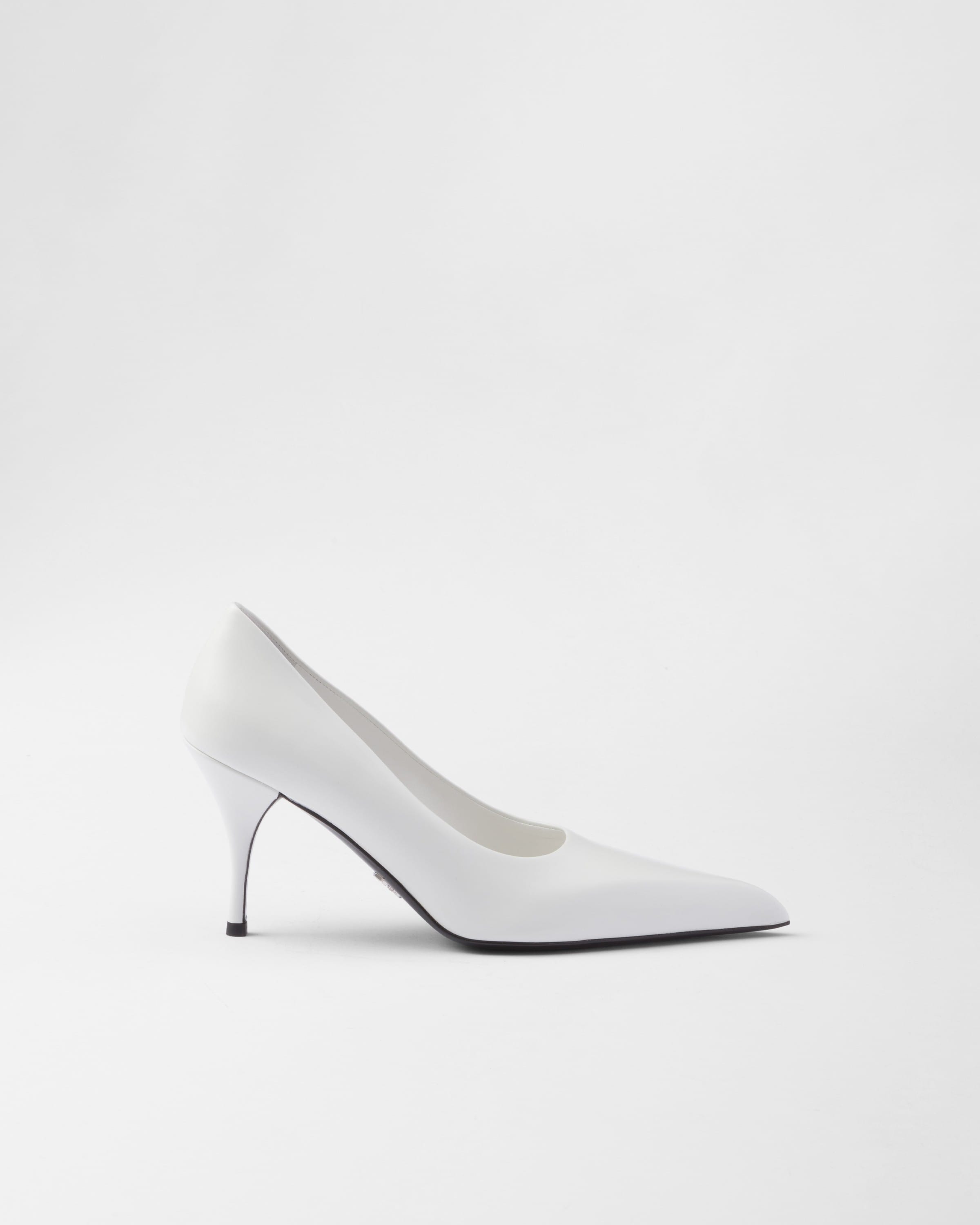 Shop Prada Leather Pumps In White