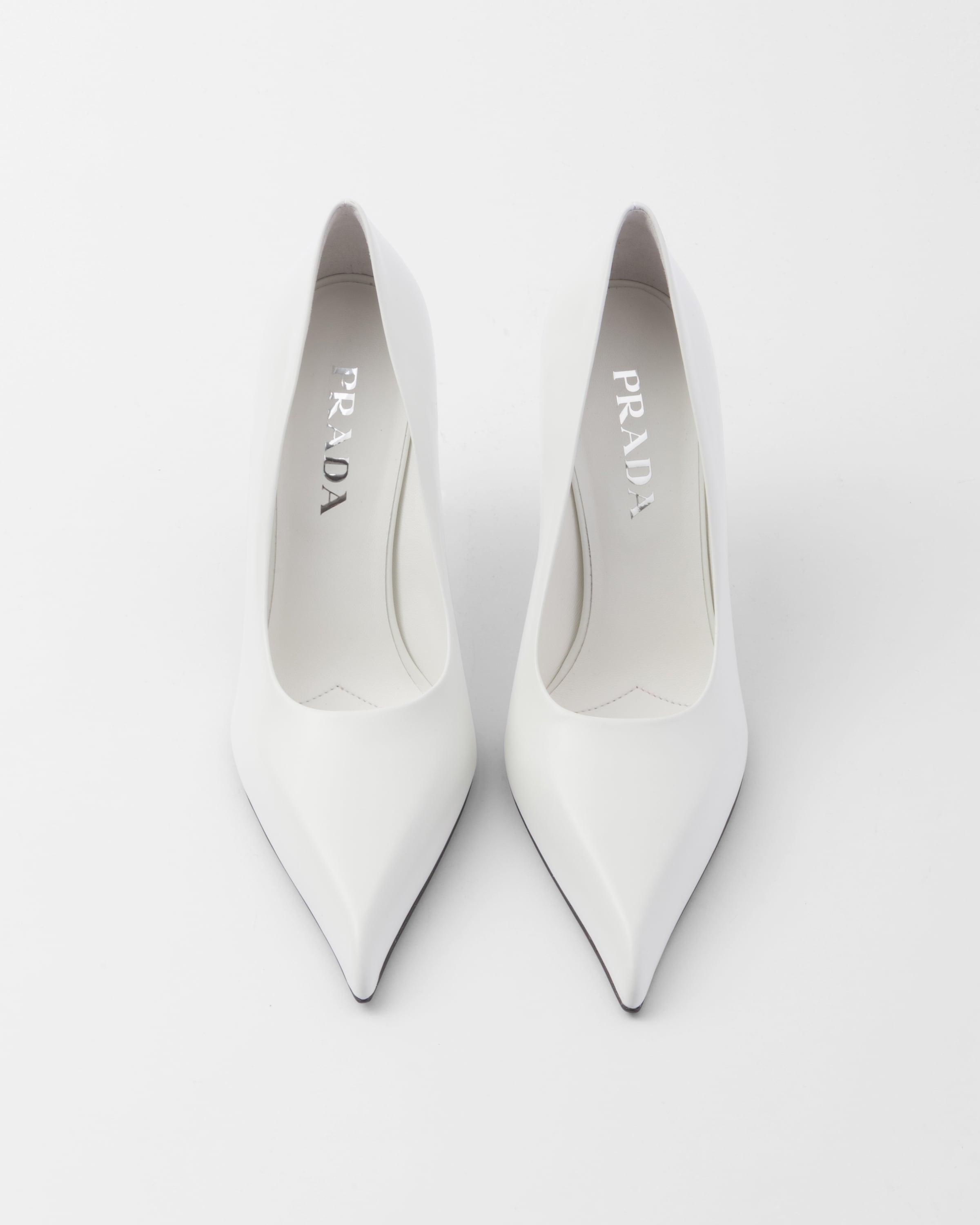 Shop Prada Leather Pumps In White