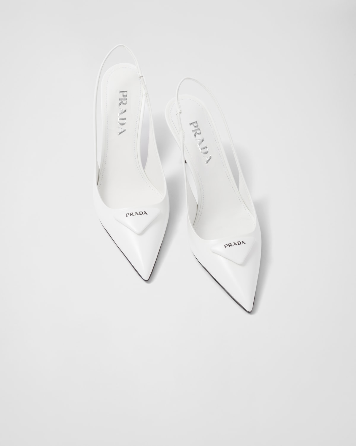PRADA 25S METAL-TOE SLINGBACK PUMPS IN WHITE CALFSKIN main image 0