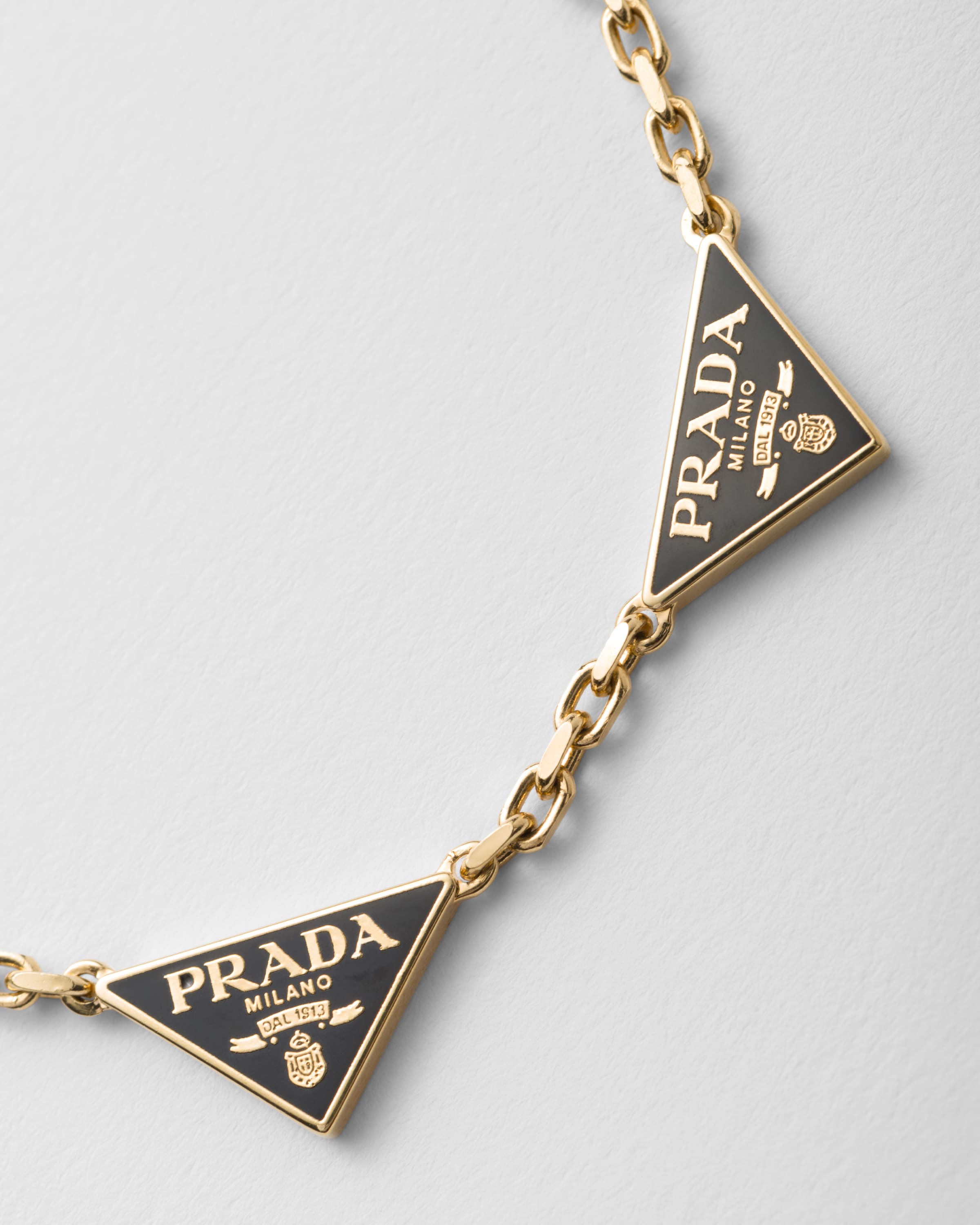 Black/Gold Enameled metal bracelet | PRADA