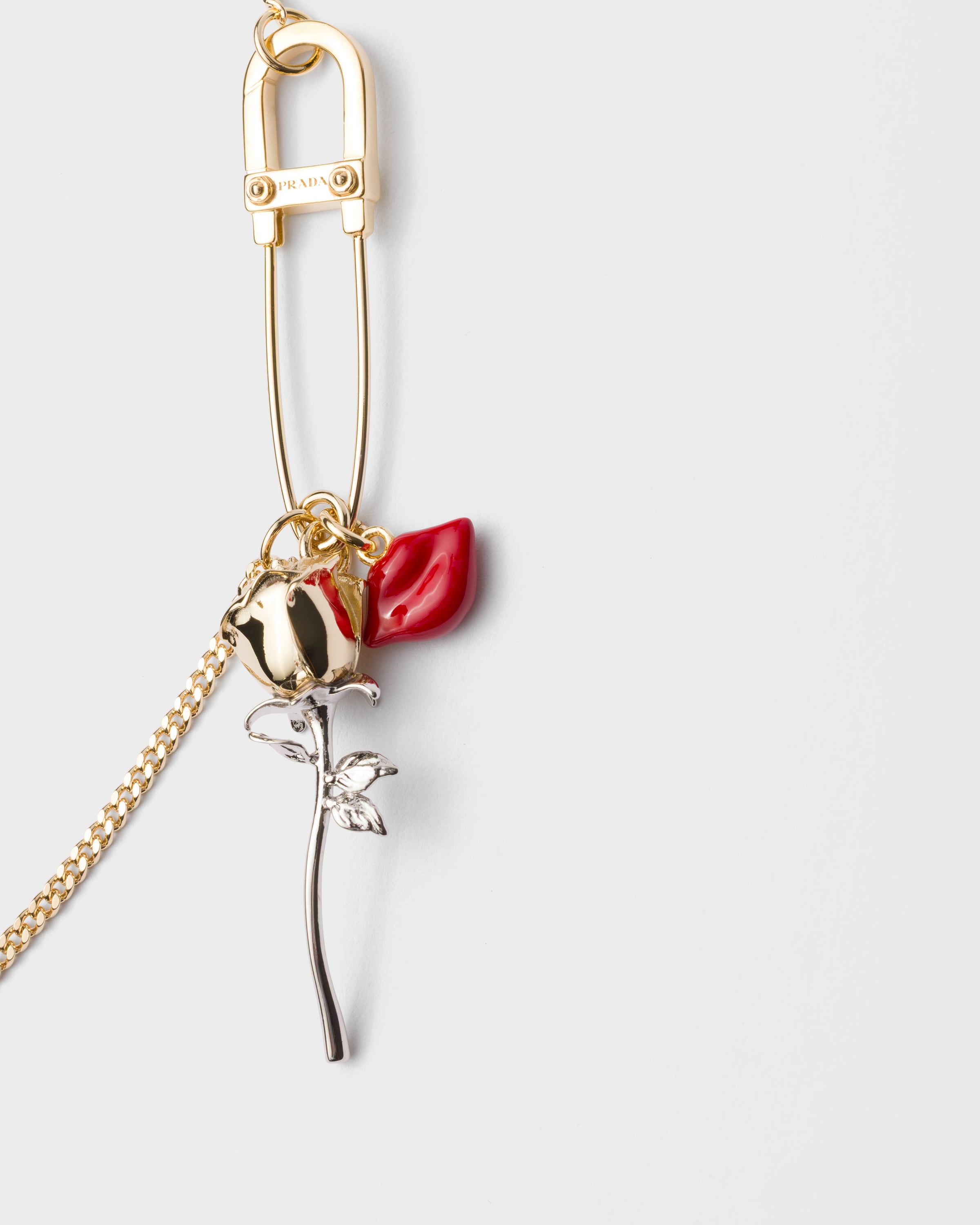 ゴールド エナメルメタル ピアス | PRADA