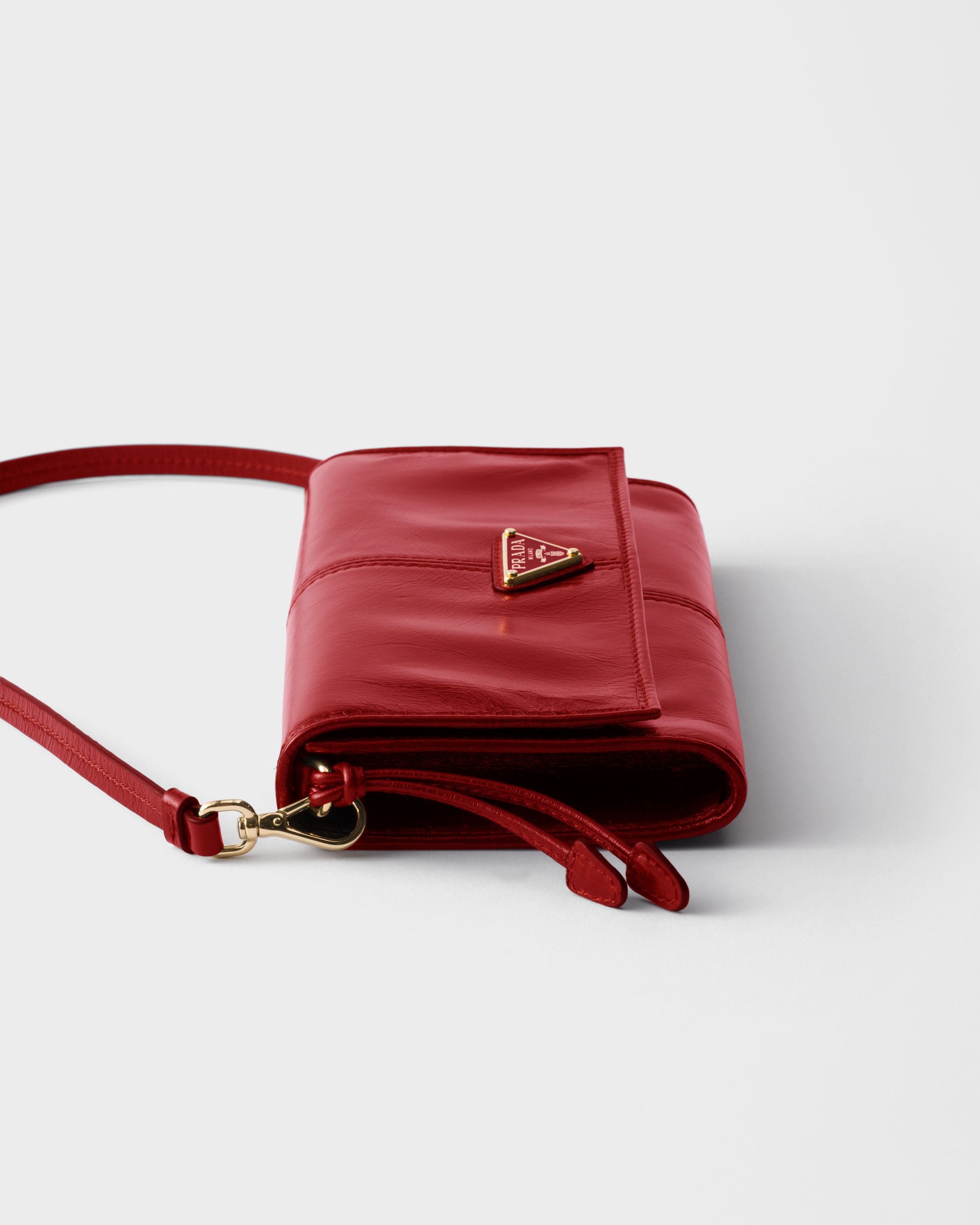 Red Leather wallet with shoulder strap | PRADA - Canada