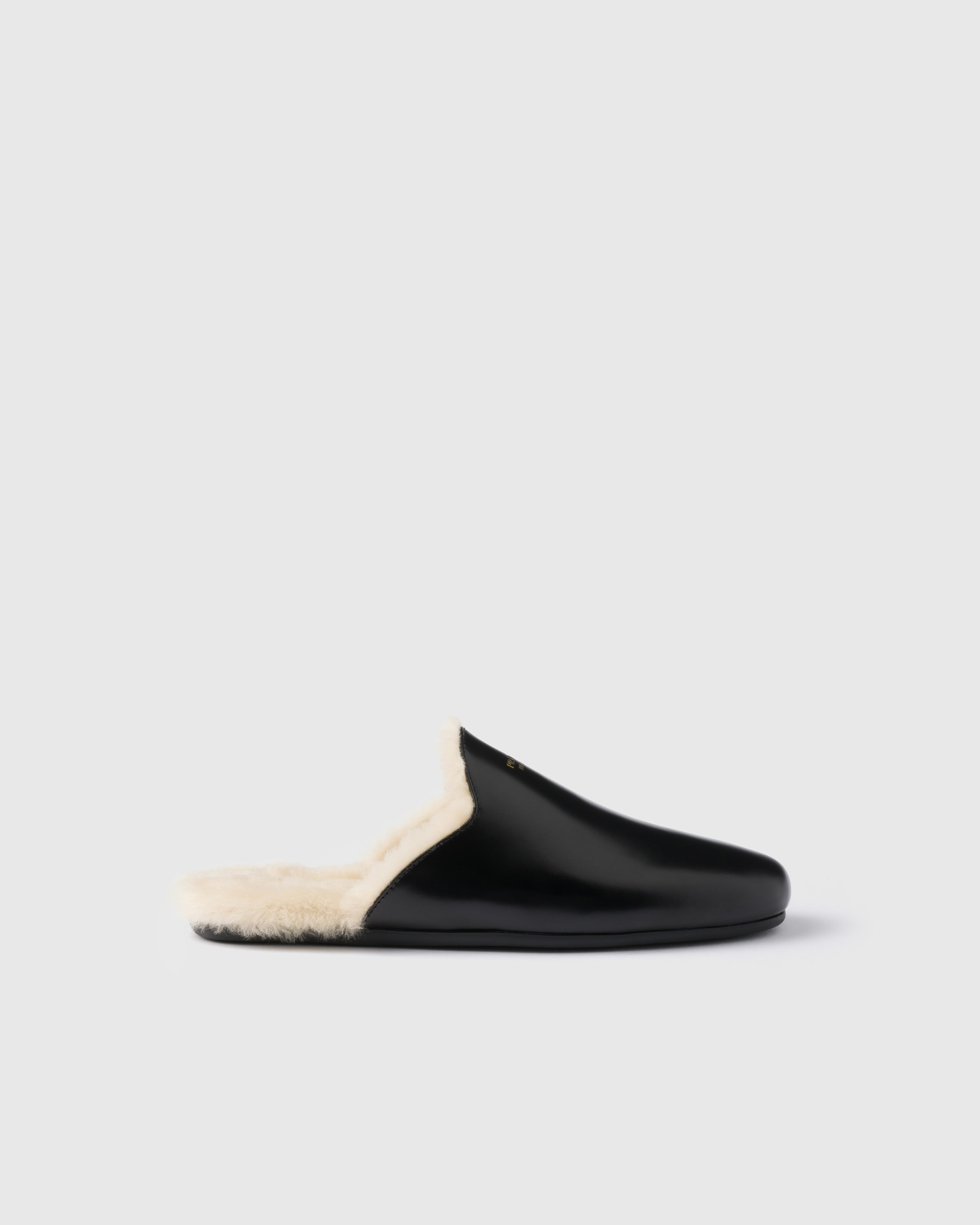 Prada Brushed Leather And Shearling Mules In Black