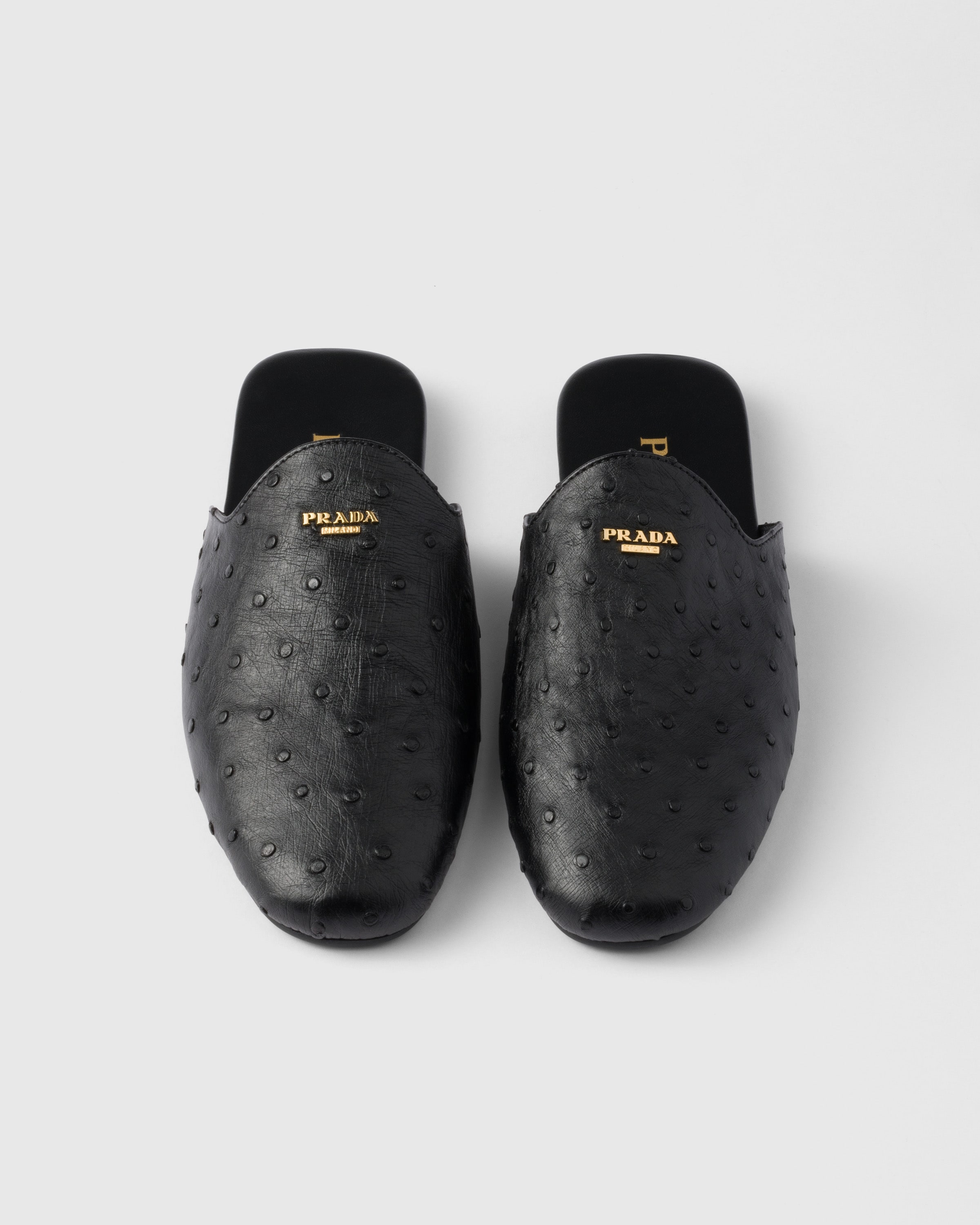 Prada Mules Aus Straussenleder In Schwarz