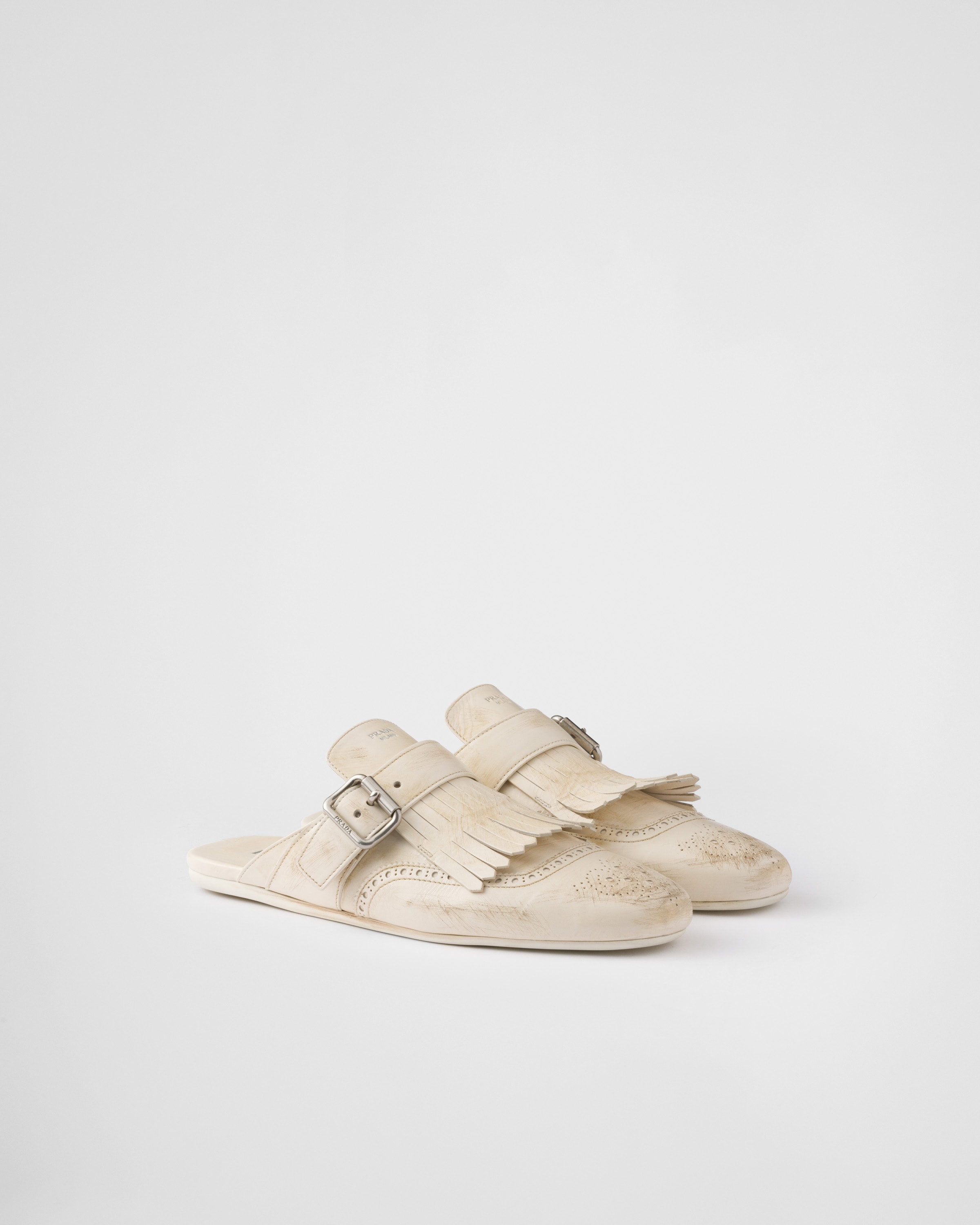 Chalk White Shuffle fringed leather mules | PRADA