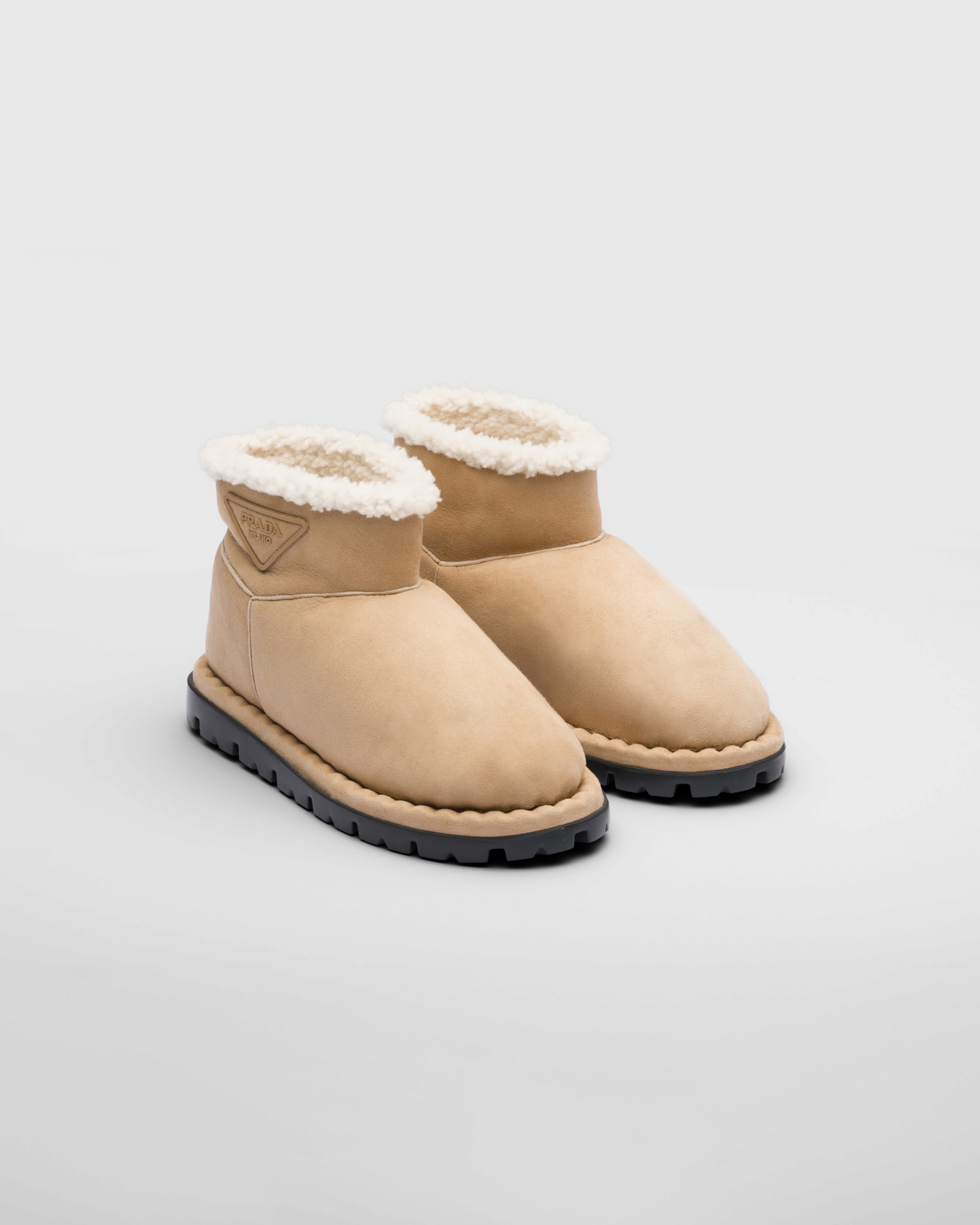 Prada Triangle-logo Suede Boots In Ecru