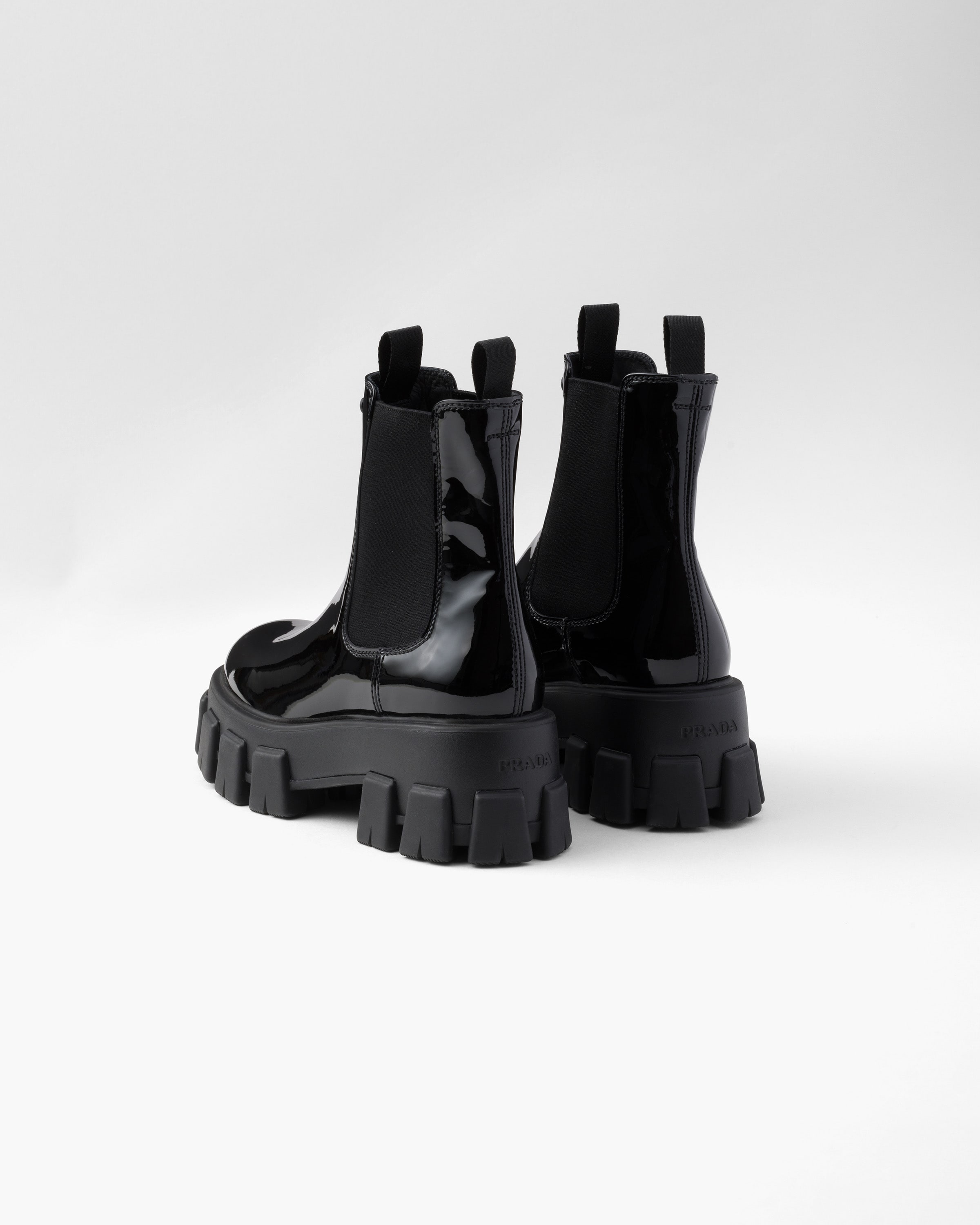 Prada Monolith Patent Leather Booties In Black