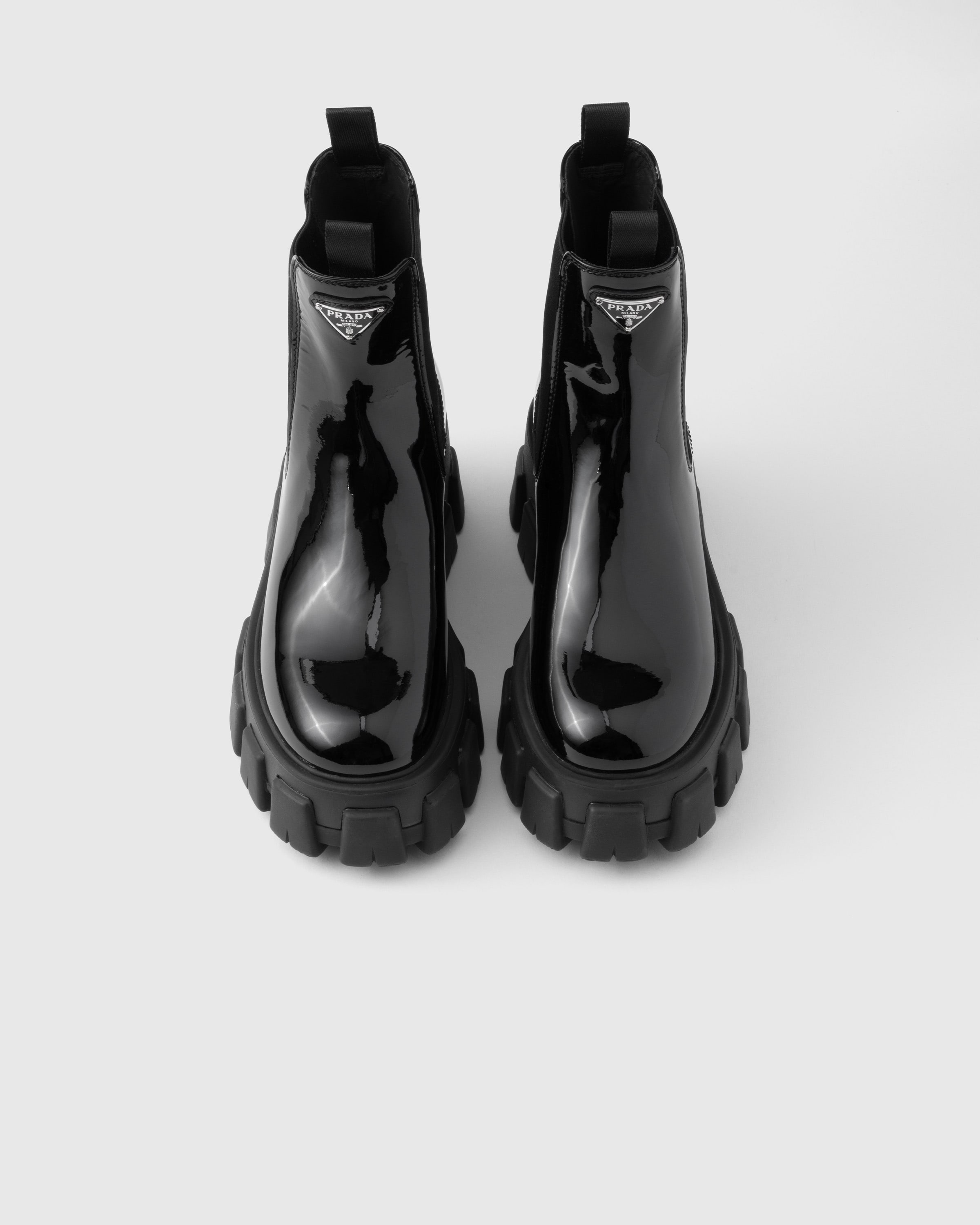 Prada Monolith Patent Leather Booties In Black