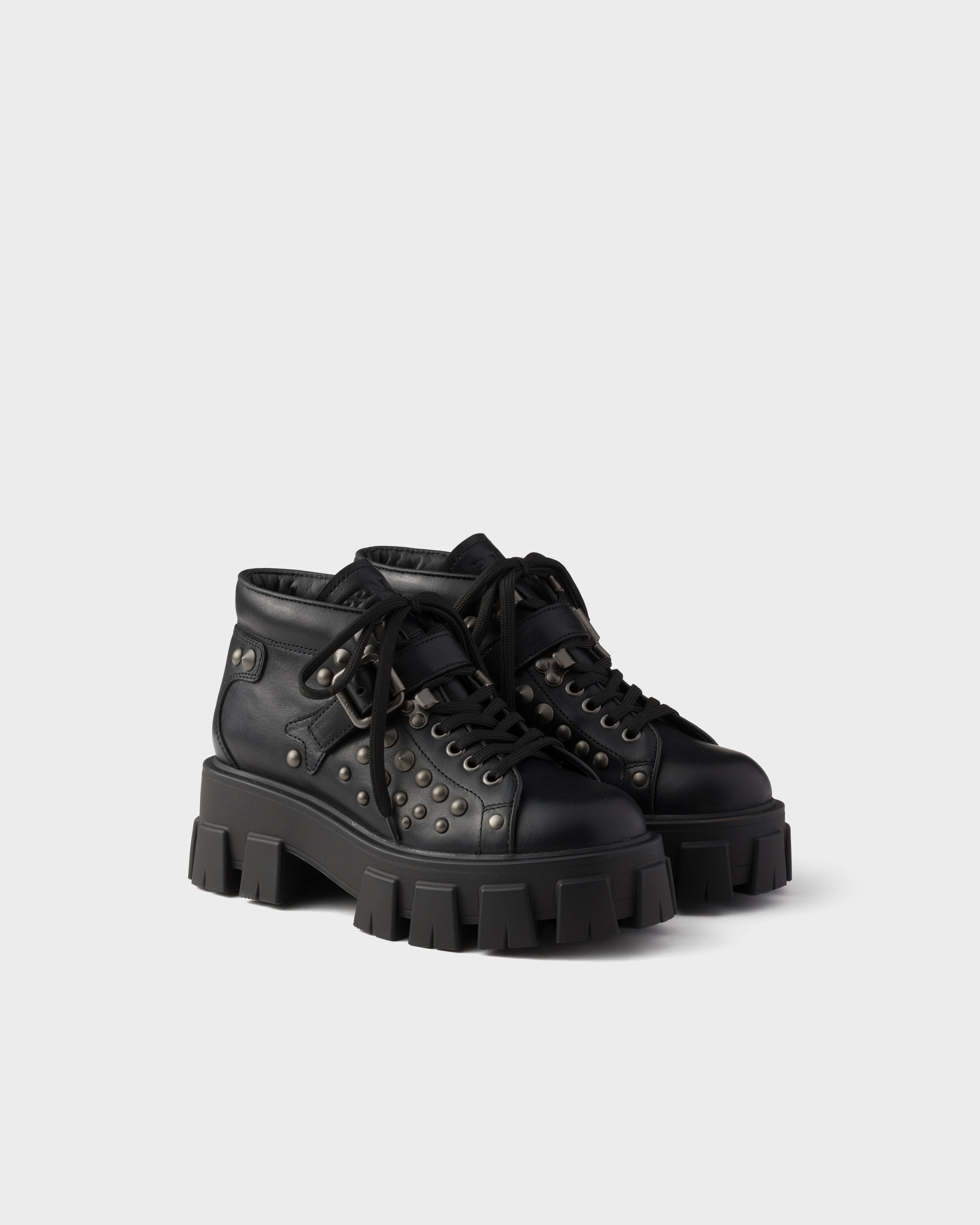 Black Monolith studded leather booties | PRADA - United States
