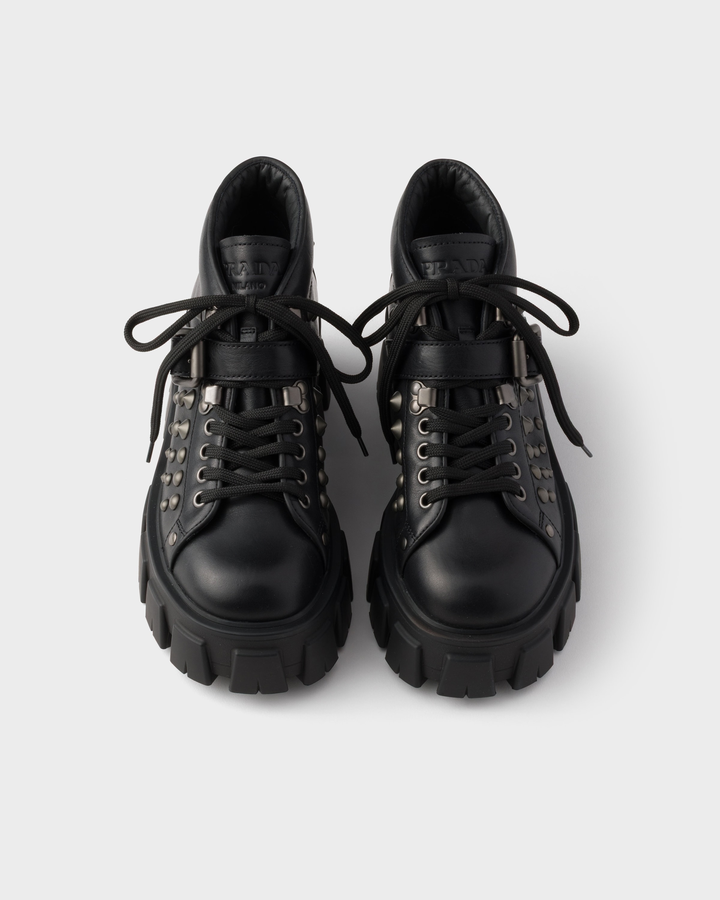 Black Monolith studded leather booties | PRADA - United States