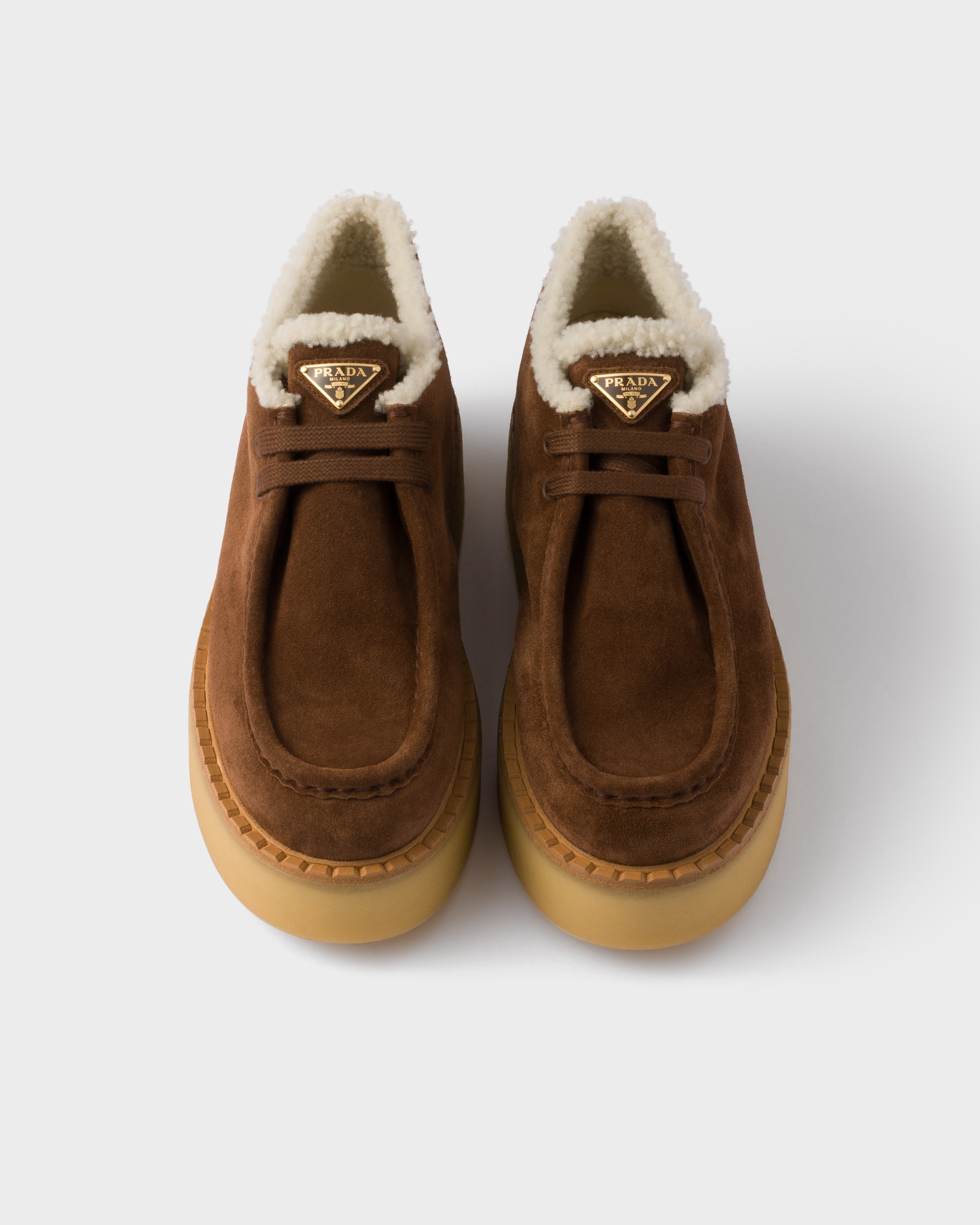 Prada Suede Shearling Lace-up Booties In Brown