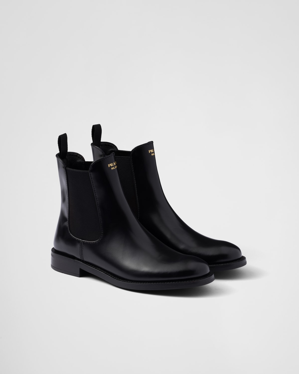 PRADA 25S POINTED TALL BOOTS 50MM IN BLACK GLOSSY CALFSKIN WITH LOGO