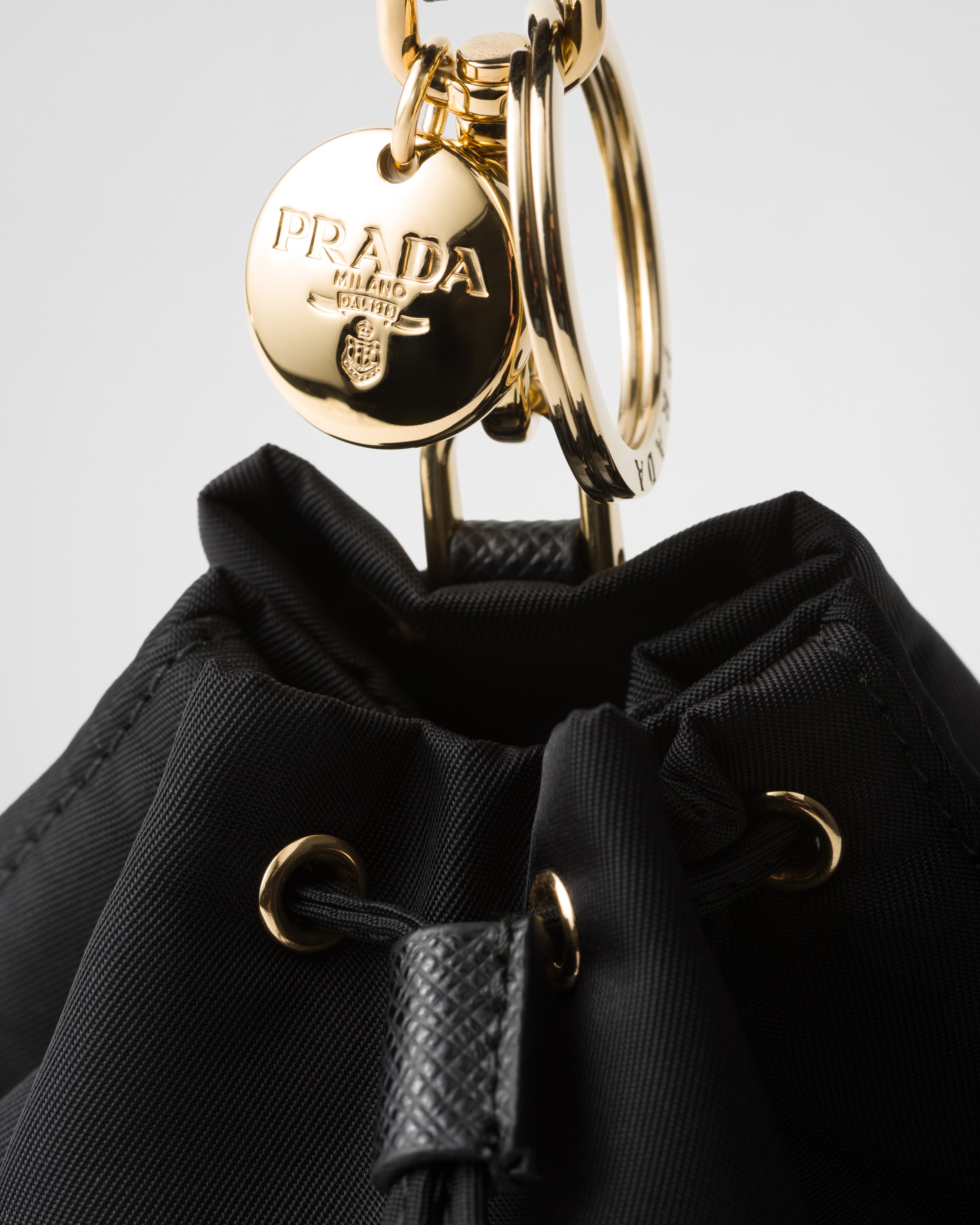 プラダミニアイコンリナイロンバッグチャームブラック Black Mini Icon Re-nylon Bag Charm | PRADA
