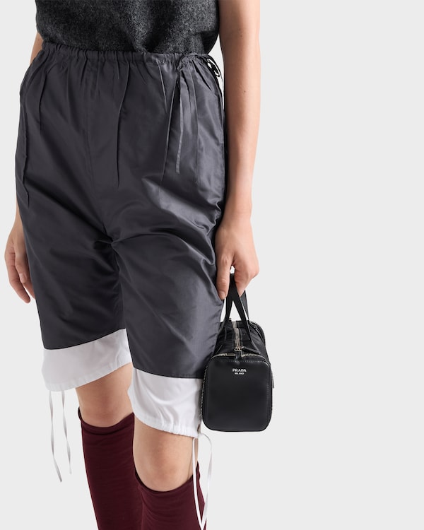Re-Nylon and leather foldable mini duffel bag - Black Re-Nylon and leather foldable mini duffel bag - Black