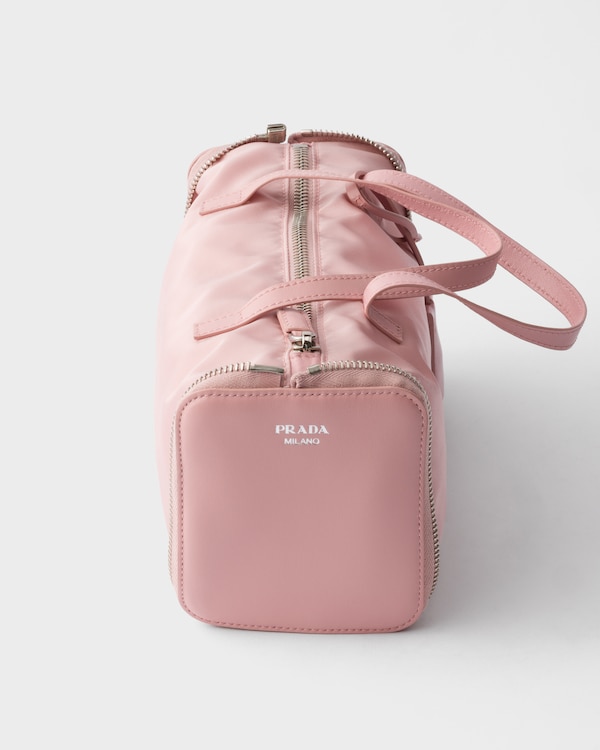 Re-Nylon and leather foldable mini duffel bag - Peach Re-Nylon and leather foldable mini duffel bag - Peach