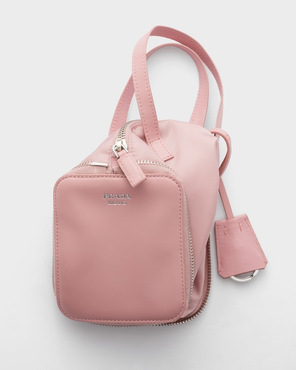 Re-Nylon and leather foldable mini duffel bag - Peach Re-Nylon and leather foldable mini duffel bag - Peach