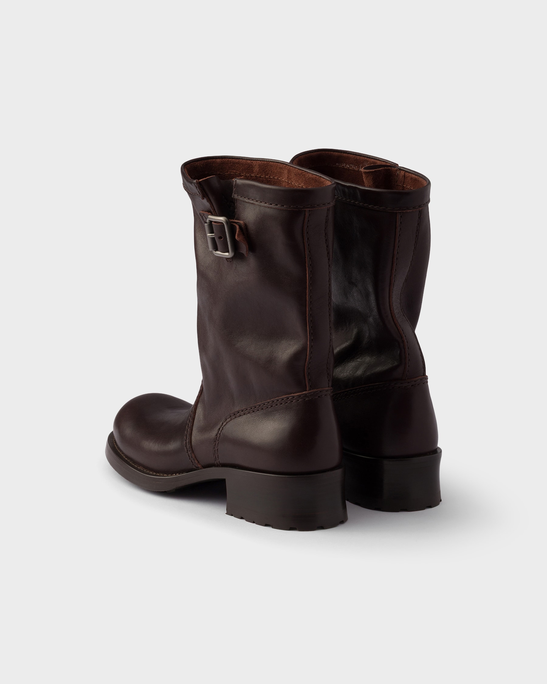 PRADA 25S LONG THICK SOLED MARTIN BOOTS 50MM IN BLACK GLOSSY CALFSKIN