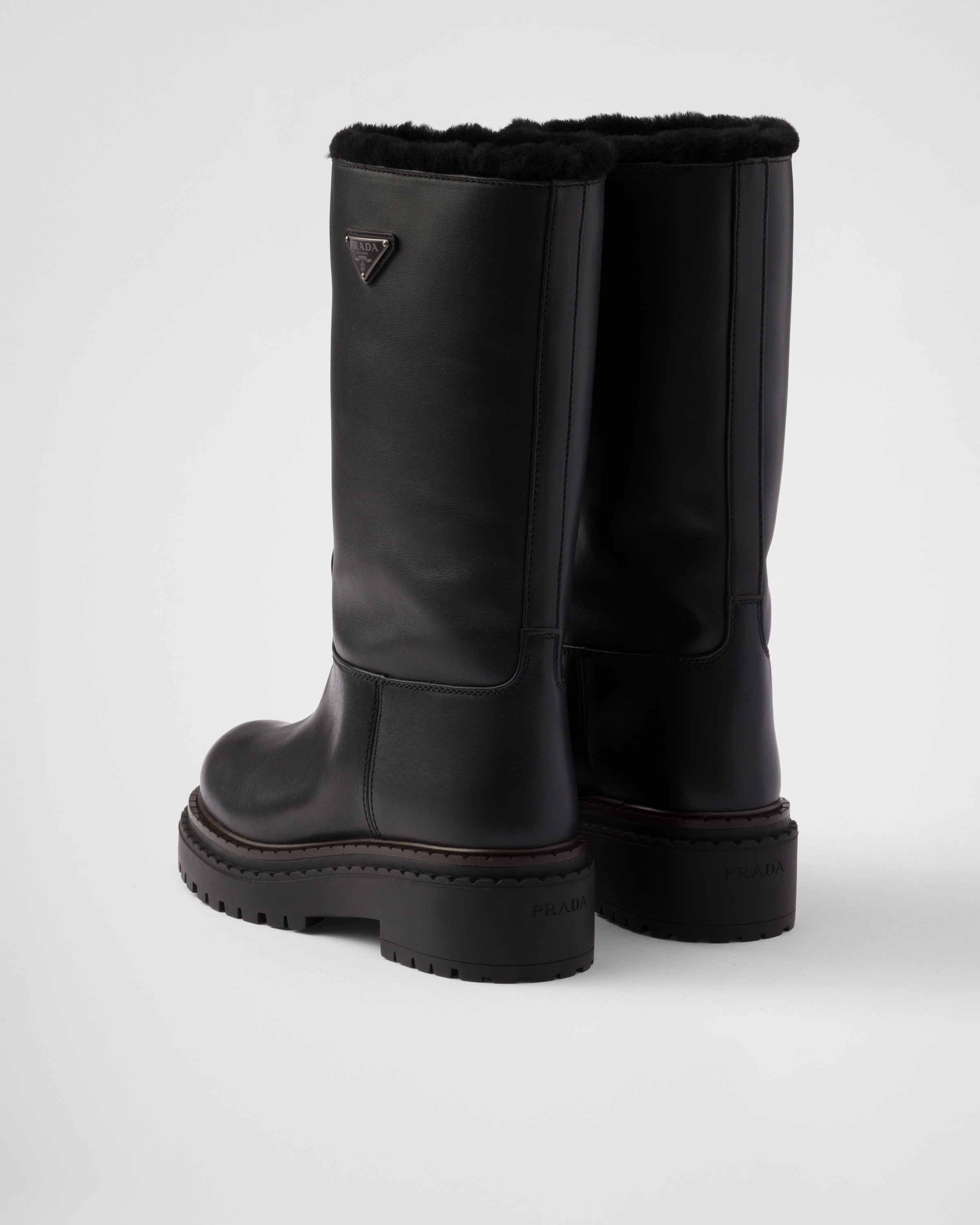 Black Leather and shearling boots | PRADA