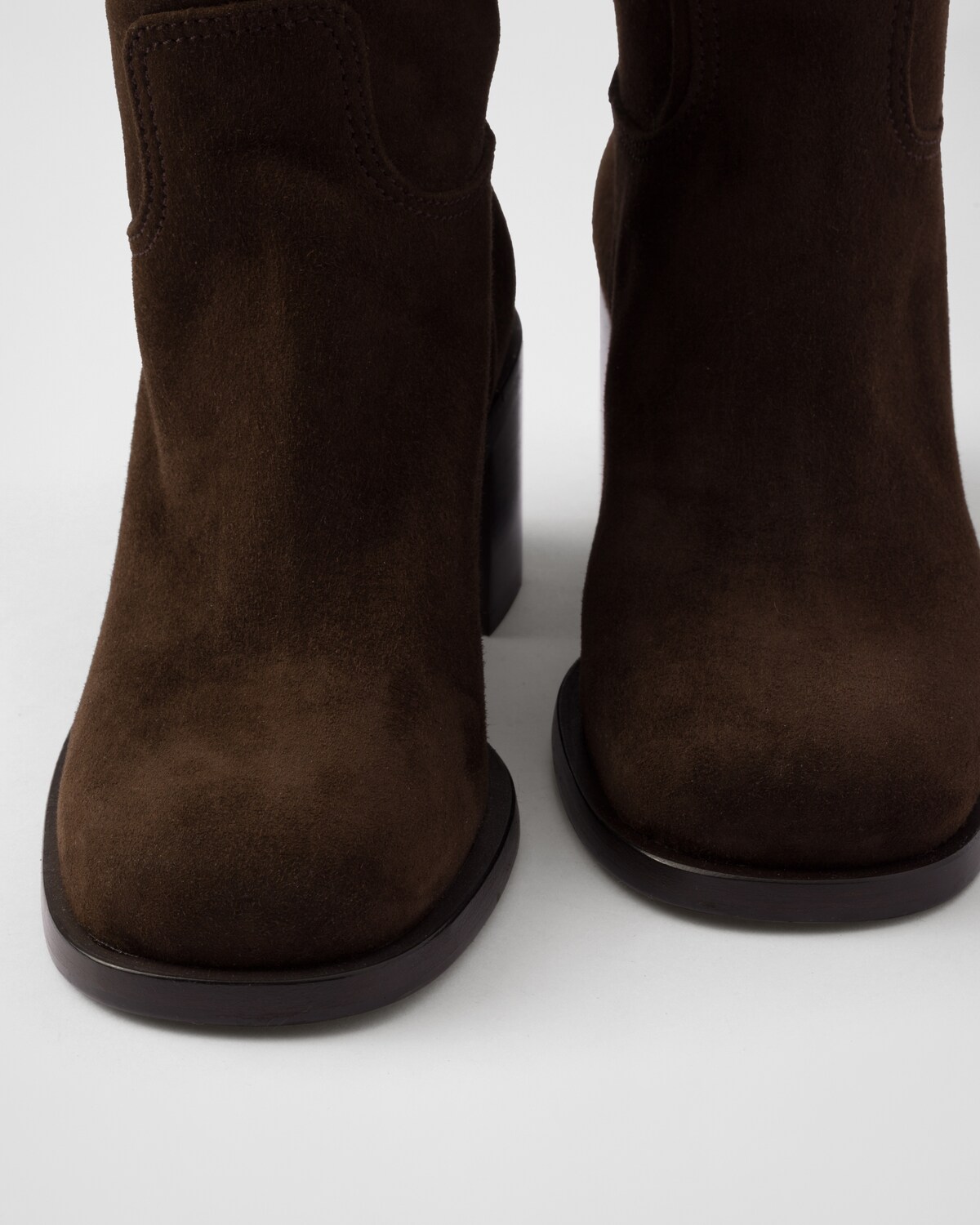 PRADA 25S ZIP-UP ANKLE BOOTS IN BEIGE SUEDE