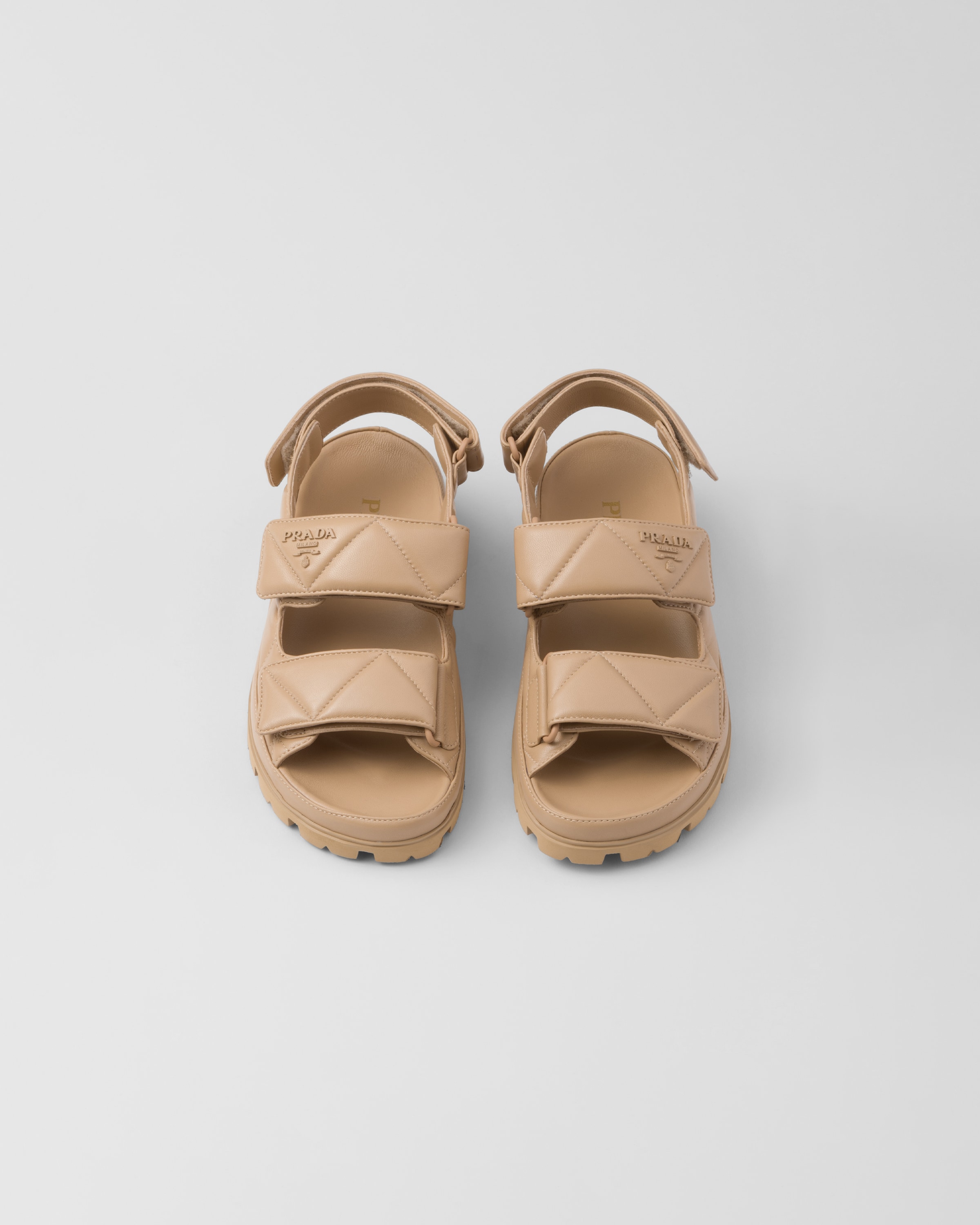 Shop Prada Padded Nappa Leather Sandals In Sand Beige