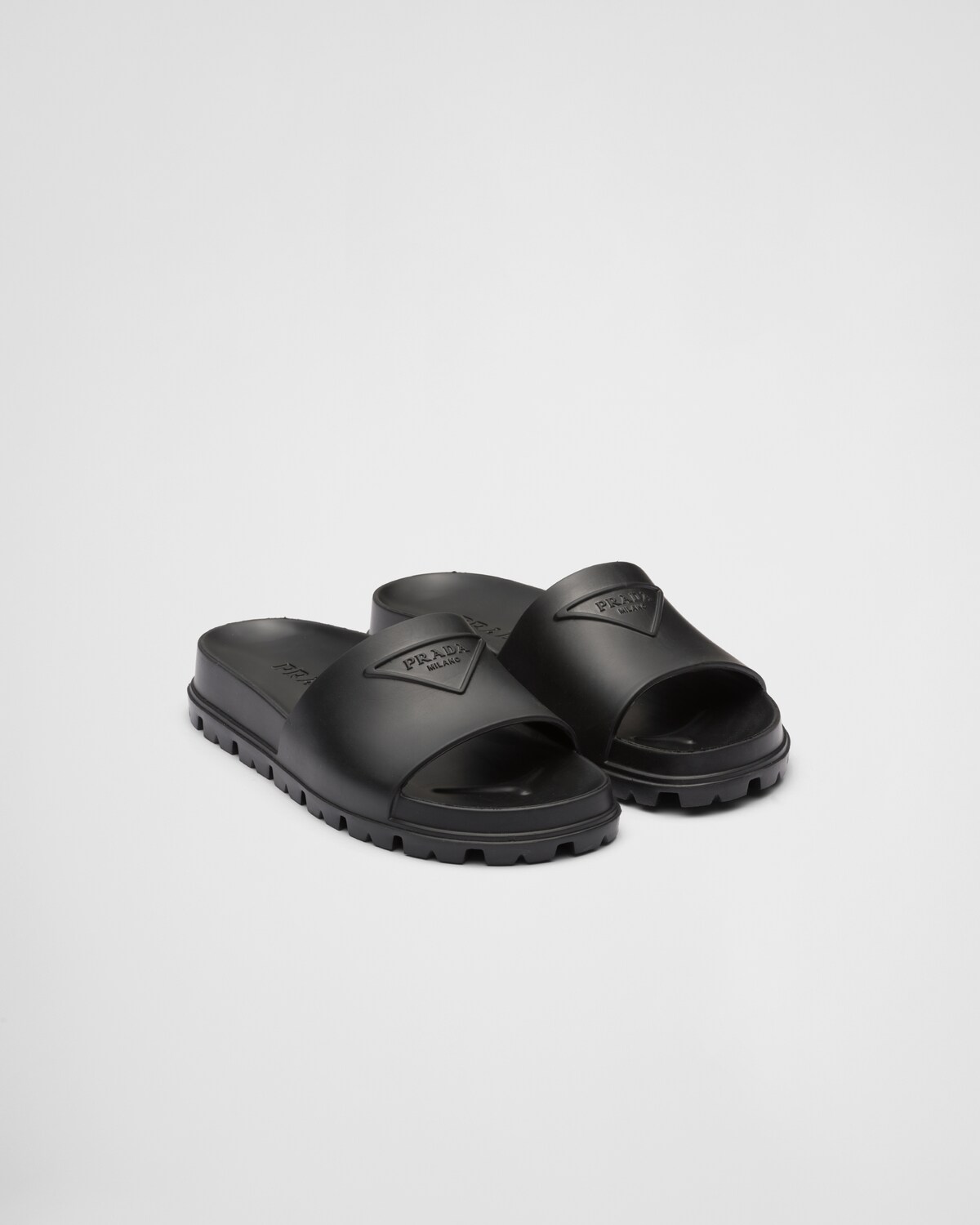 PRADA 25S RUBBER SLIDE IN BLACK CALFSKIN WITH LOGO