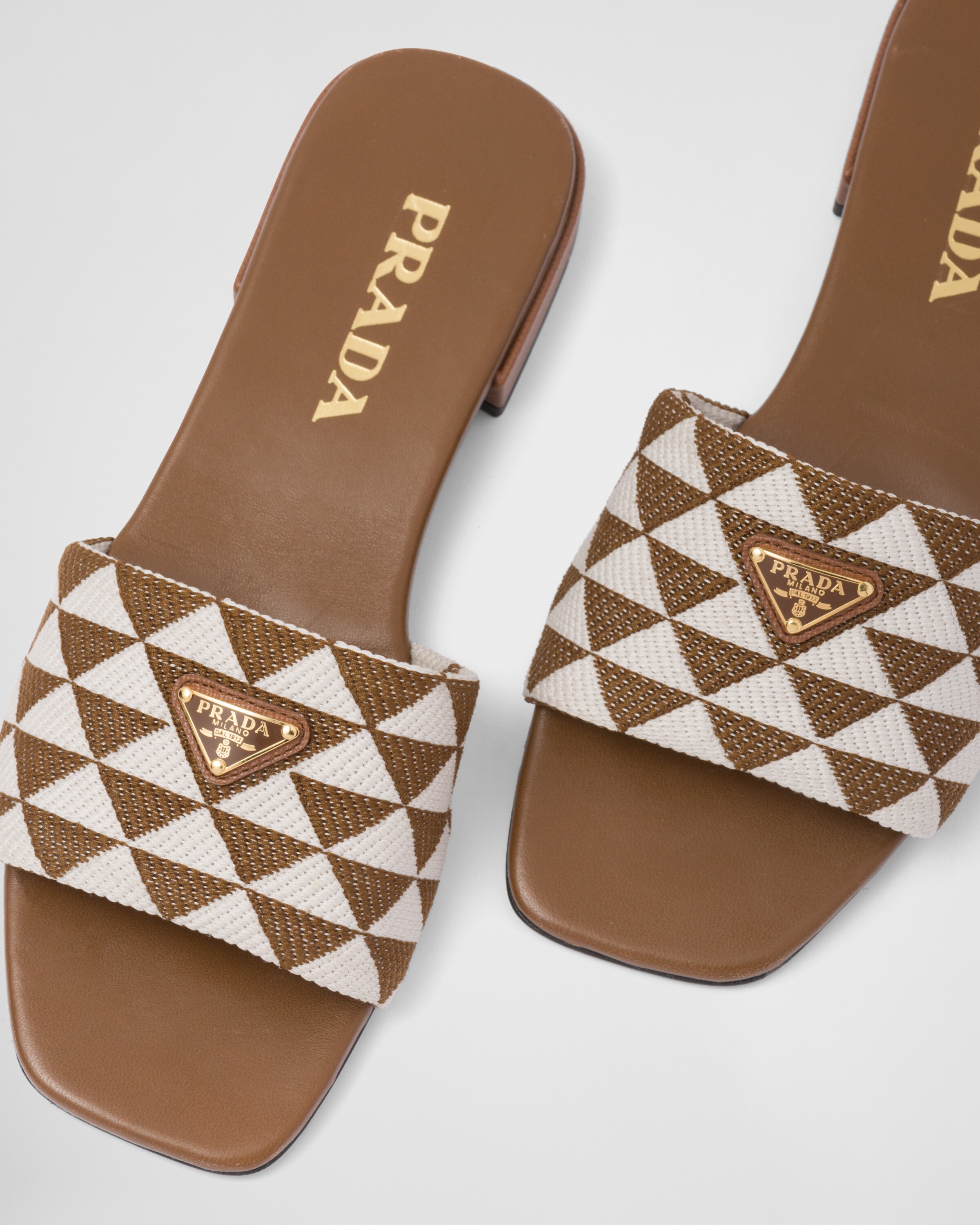 Tobacco/chalk White Embroidered fabric slides Prada