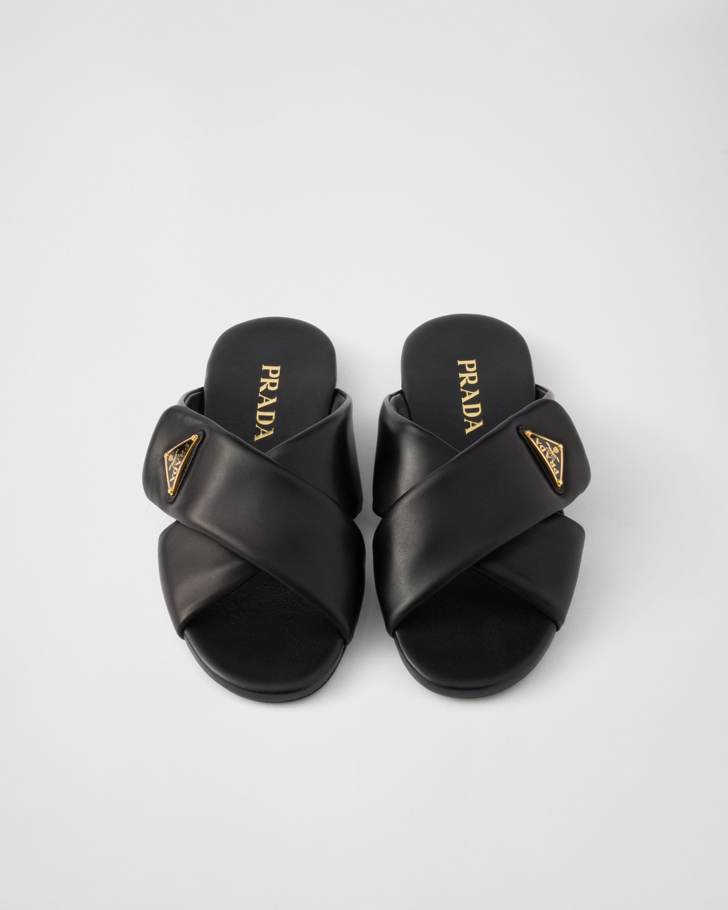Prada Padded Leather Crisscross Flat Sandals In Black