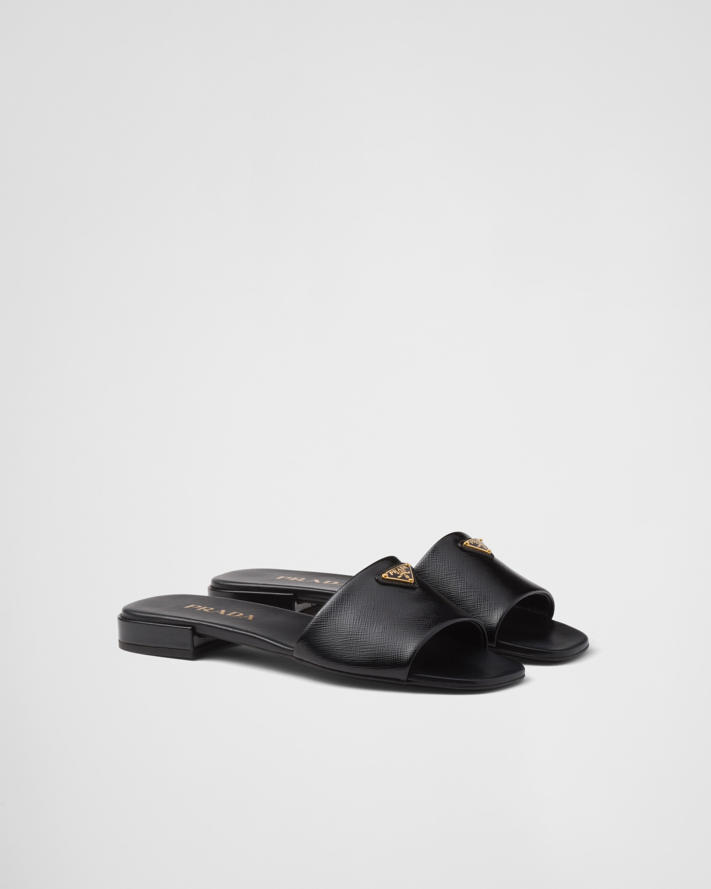 Shop Prada Saffiano Patent Leather Slides In Schwarz