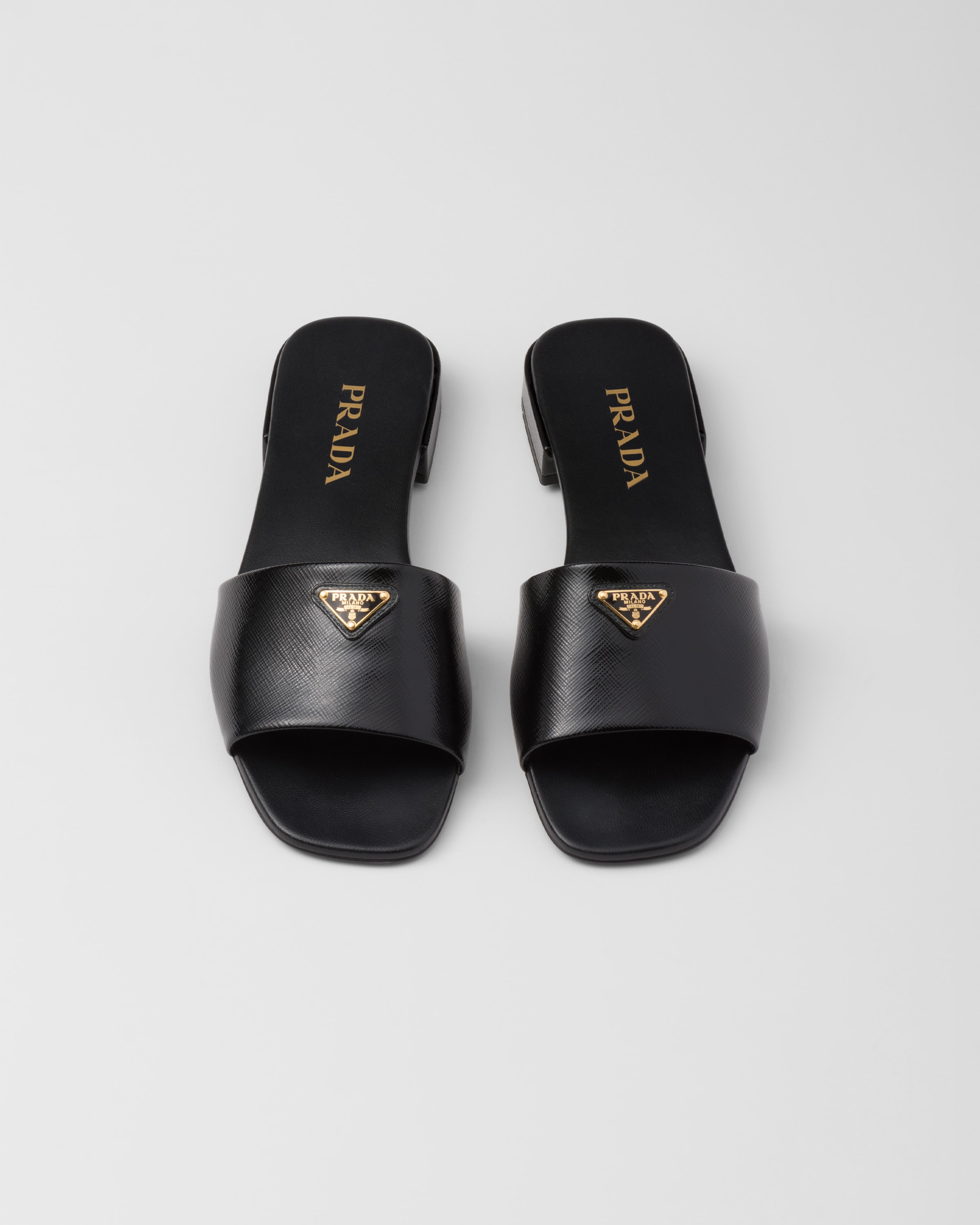 Shop Prada Saffiano Patent Leather Slides In Schwarz