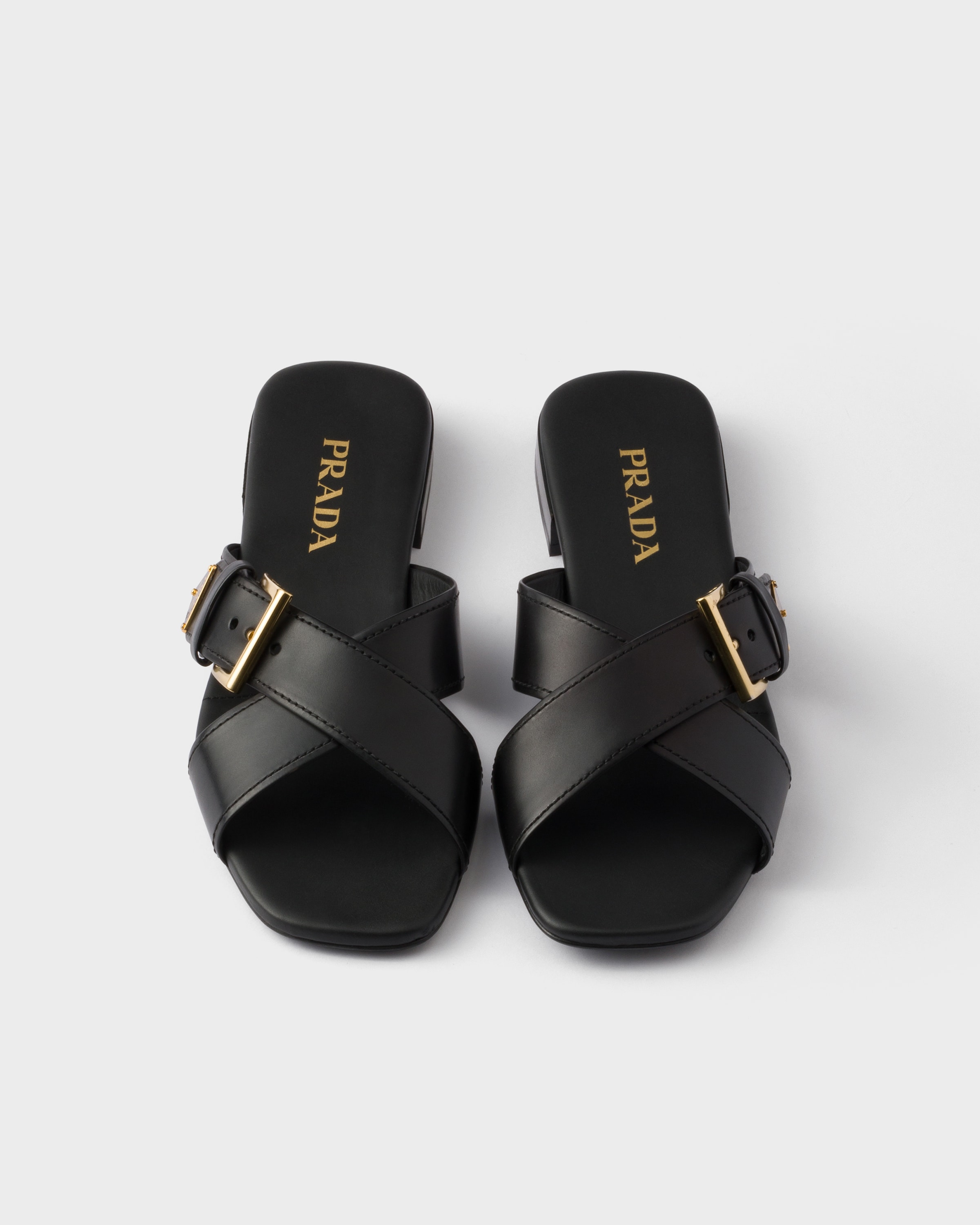 Prada Leather Crisscross Slides With Buckle In Black