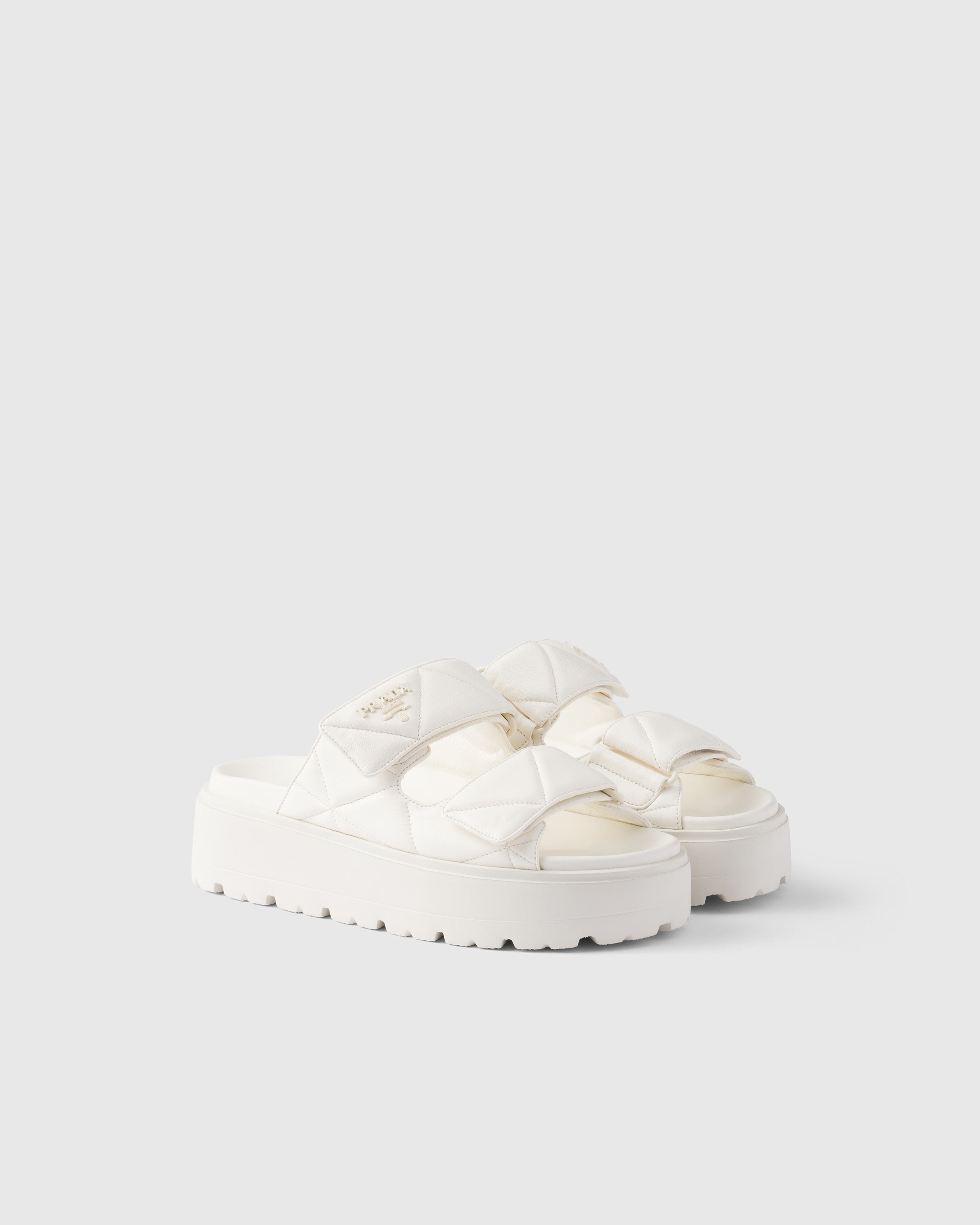 Prada Padded Nappa Leather Slides In Ivory